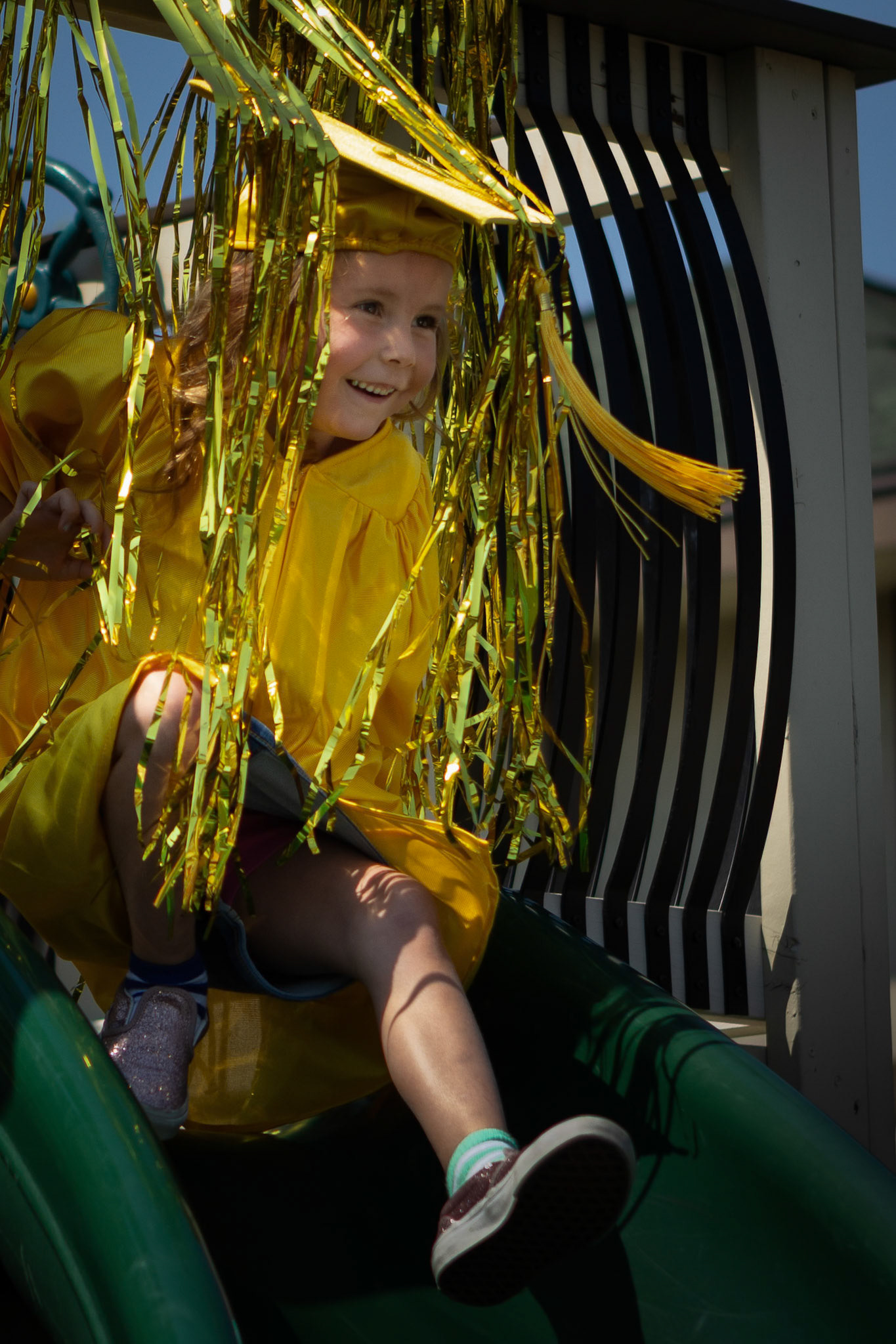 Heading down the slide to get her diploma