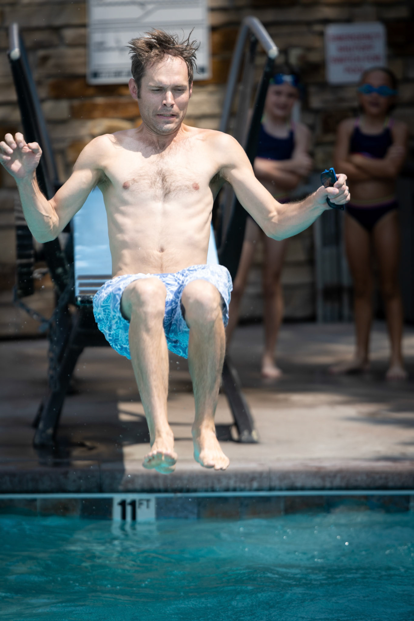 Dad practices his back flips off the diving board