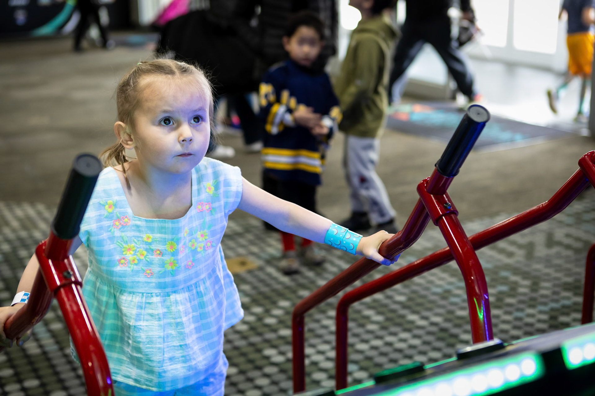 Playing the downhill ski racer game at Family Sports Center.