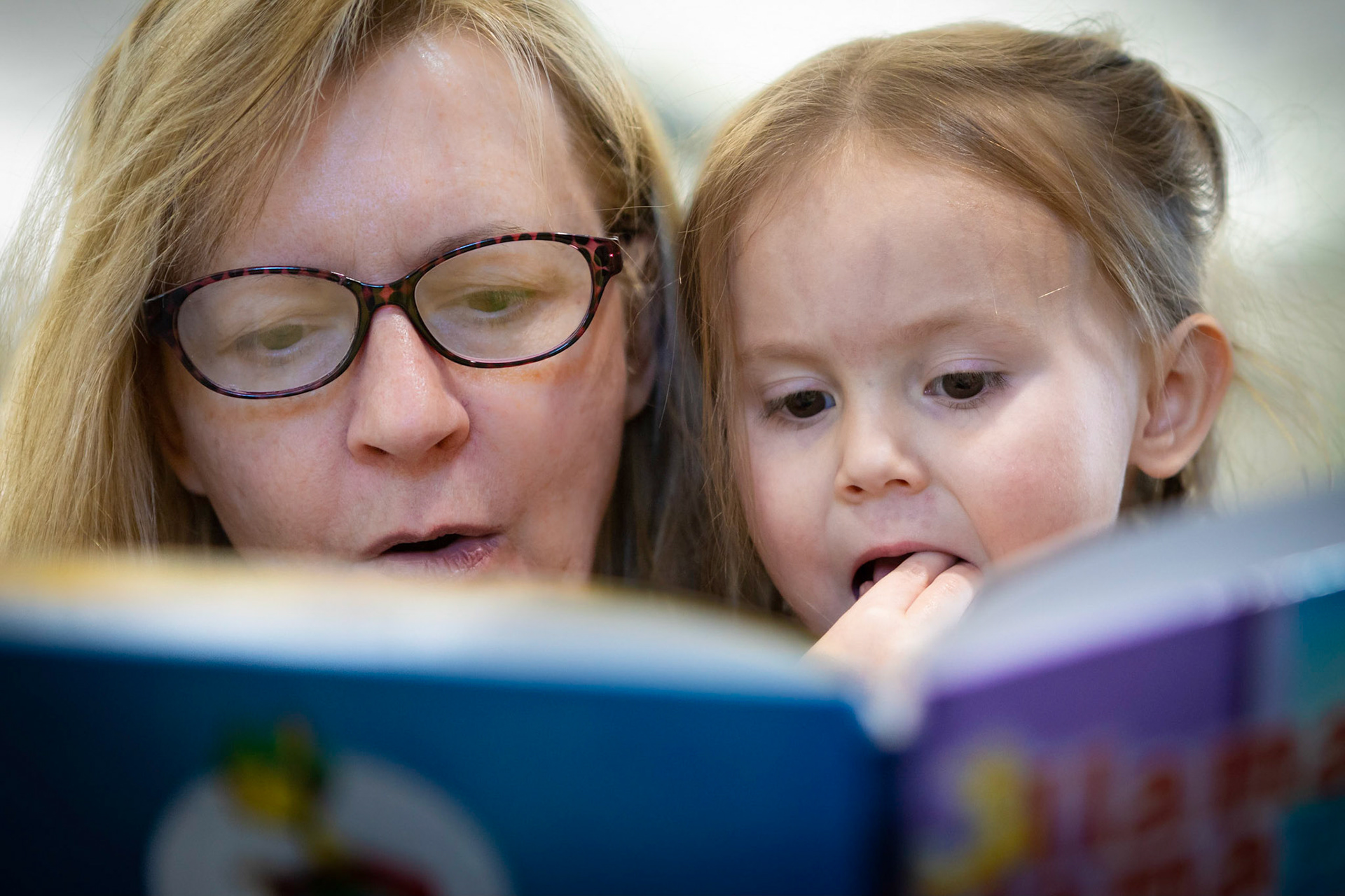 Taking in a book at the library with Mimi