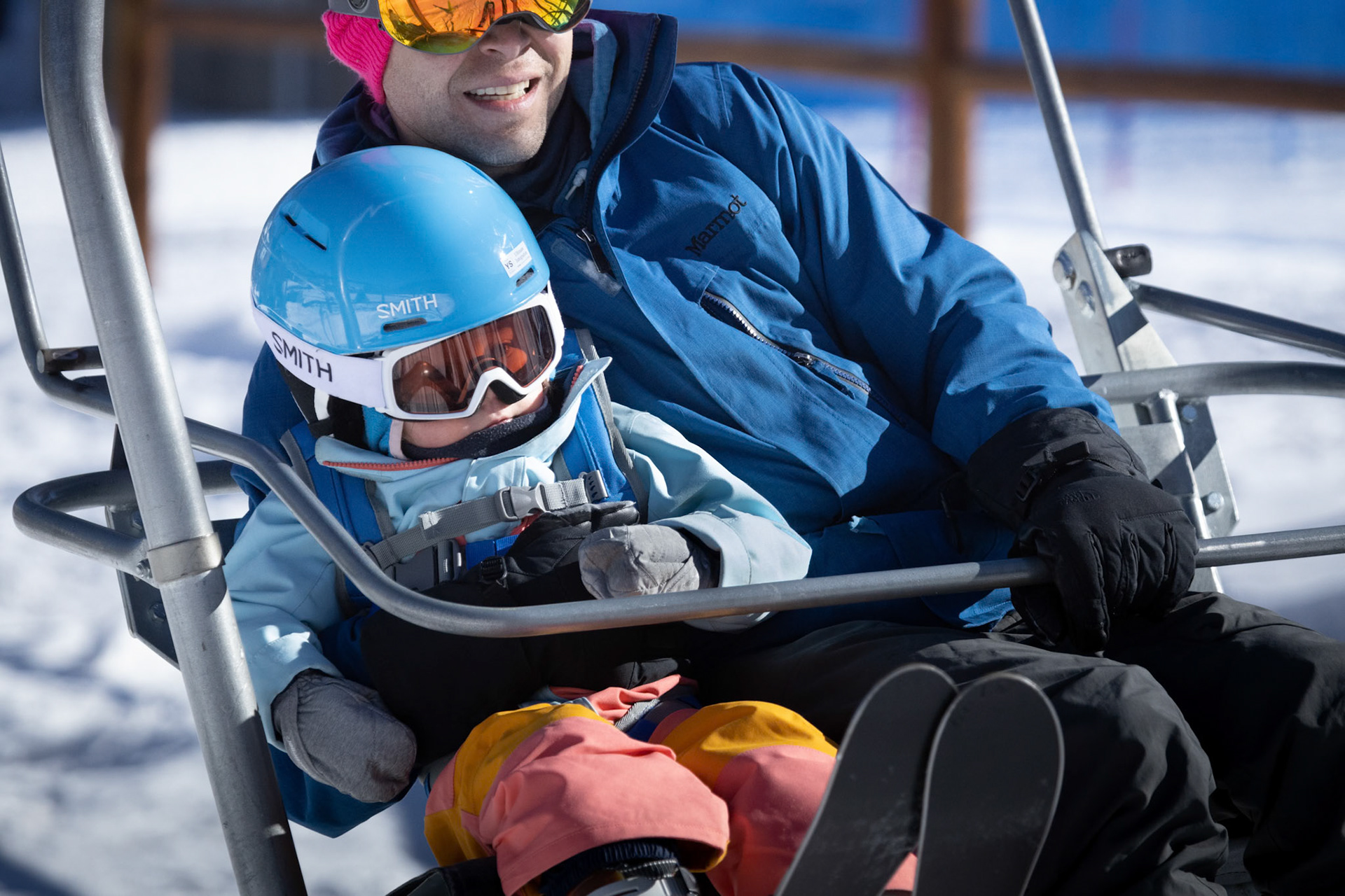 Safely aboard the ski lift with dad
