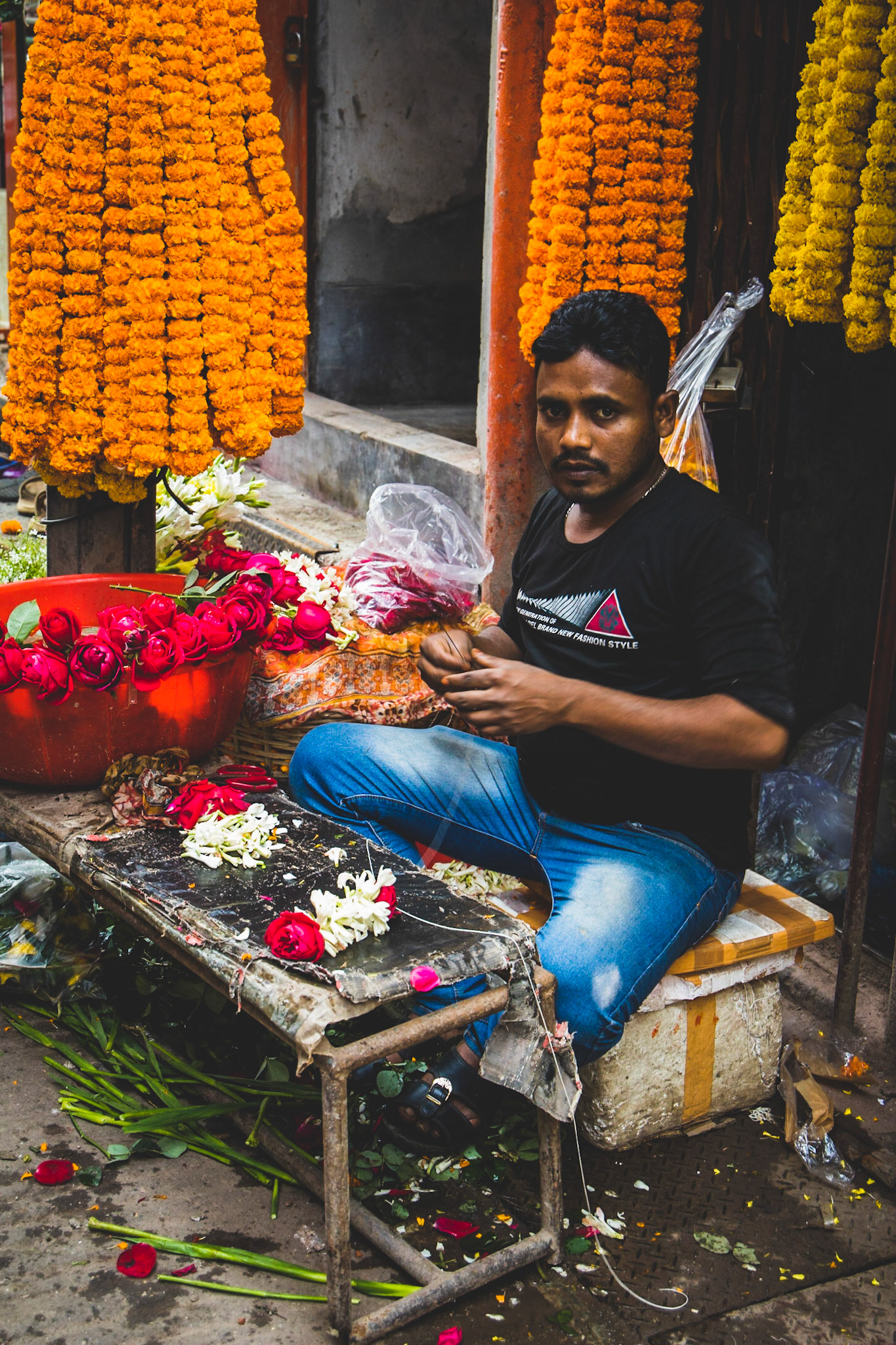 A man making garlands on Hindu Street in Old Dhaka, Bangladesh.