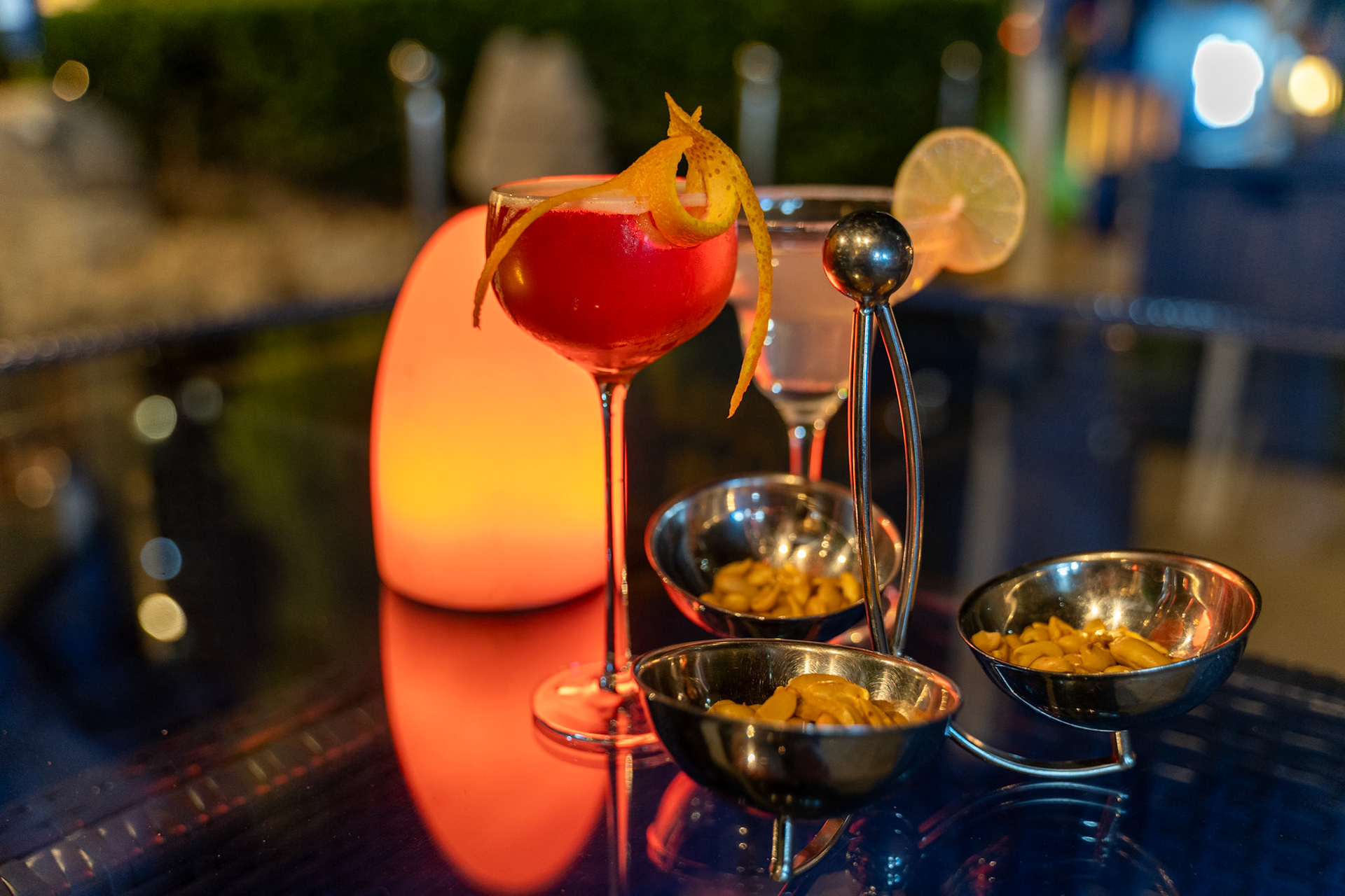 Elegant cocktail with nuts at night