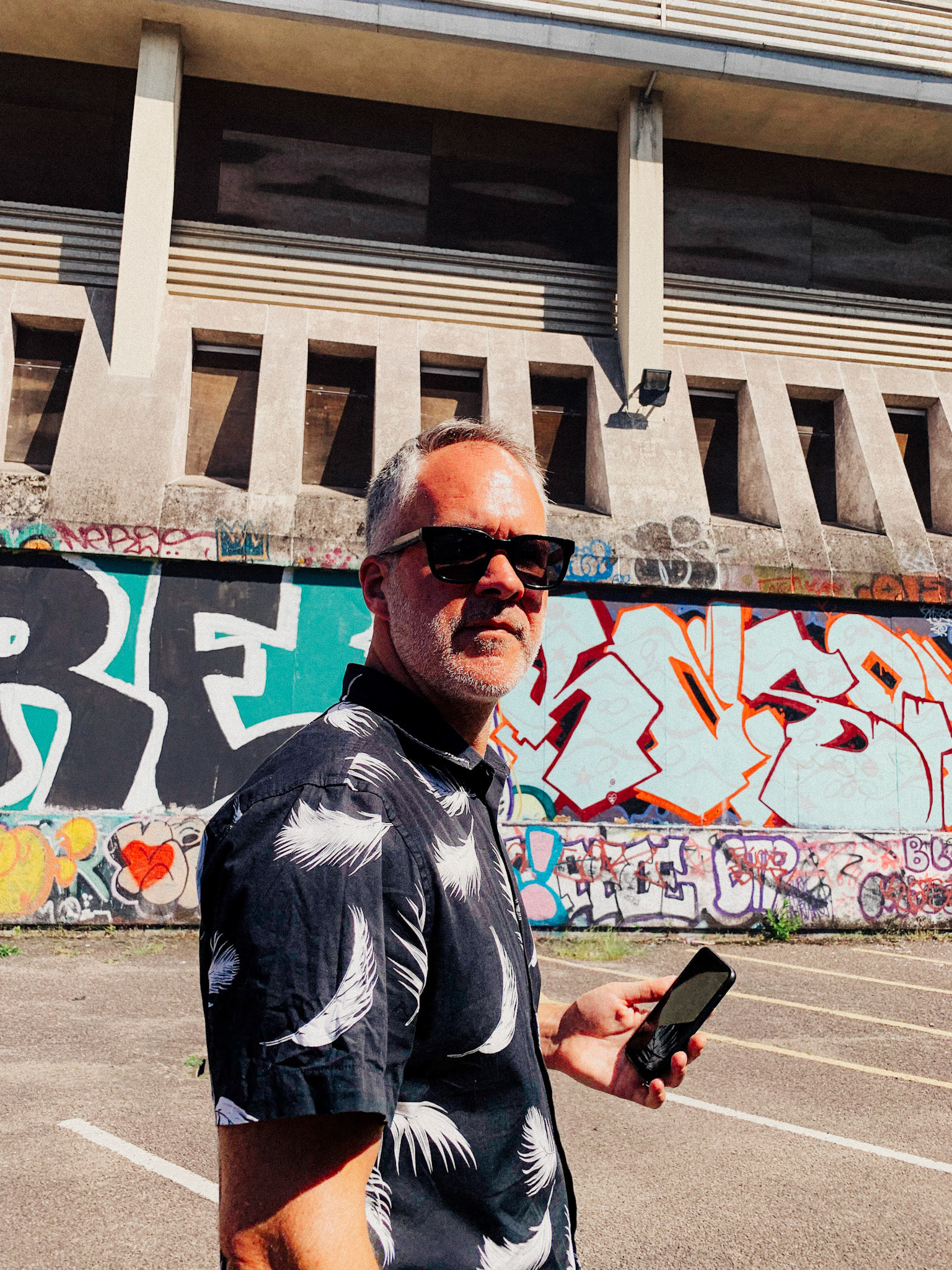 Man walking with phone in hand