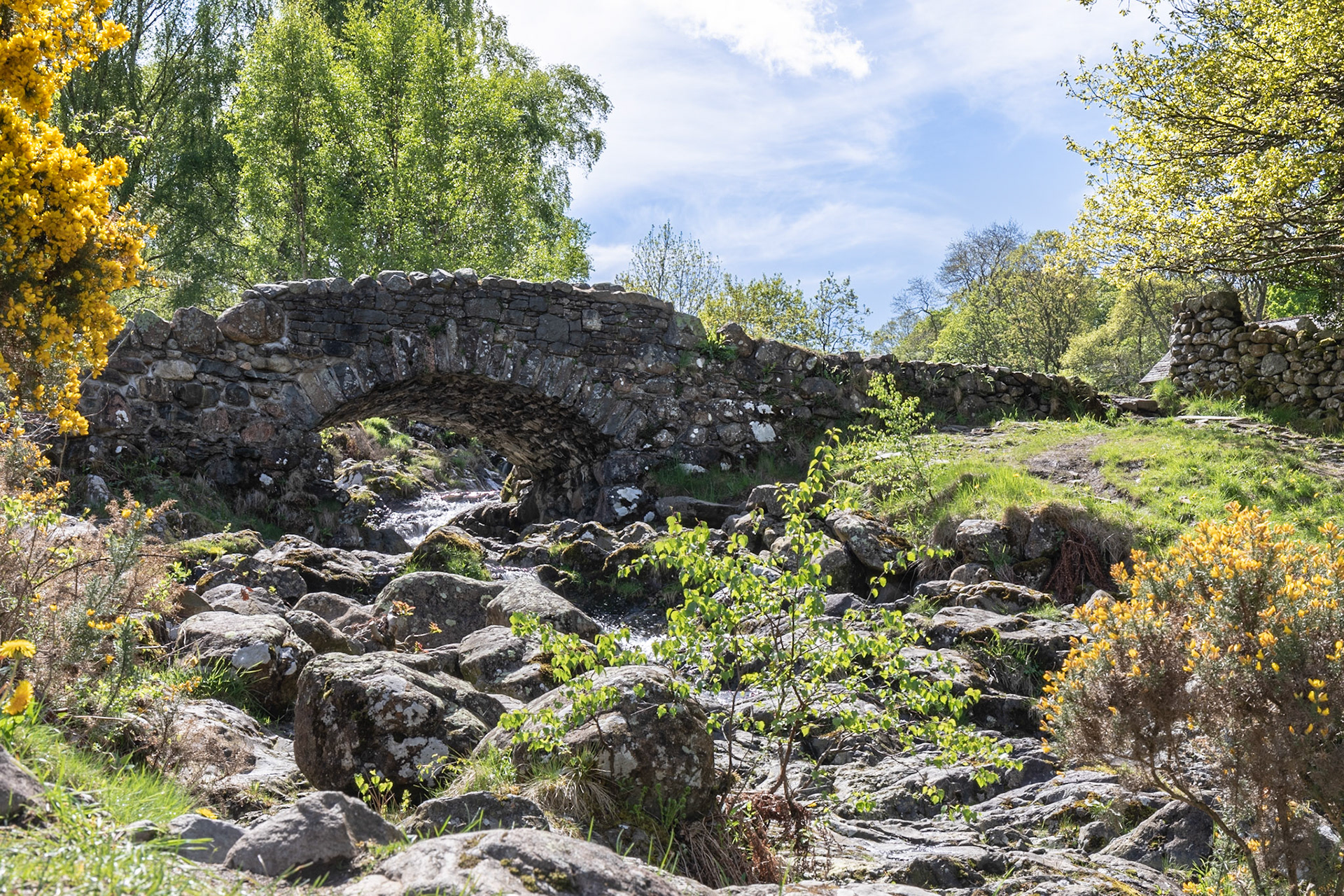 A shot of the famous Ashness Bridge - a traditional stone-built bridge on the single-track road from the Borrowdale road to Watendlath, in the Lake District