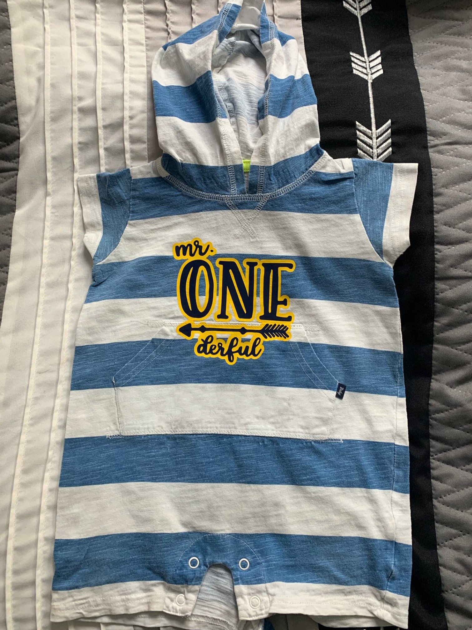 baby clothing on the bed