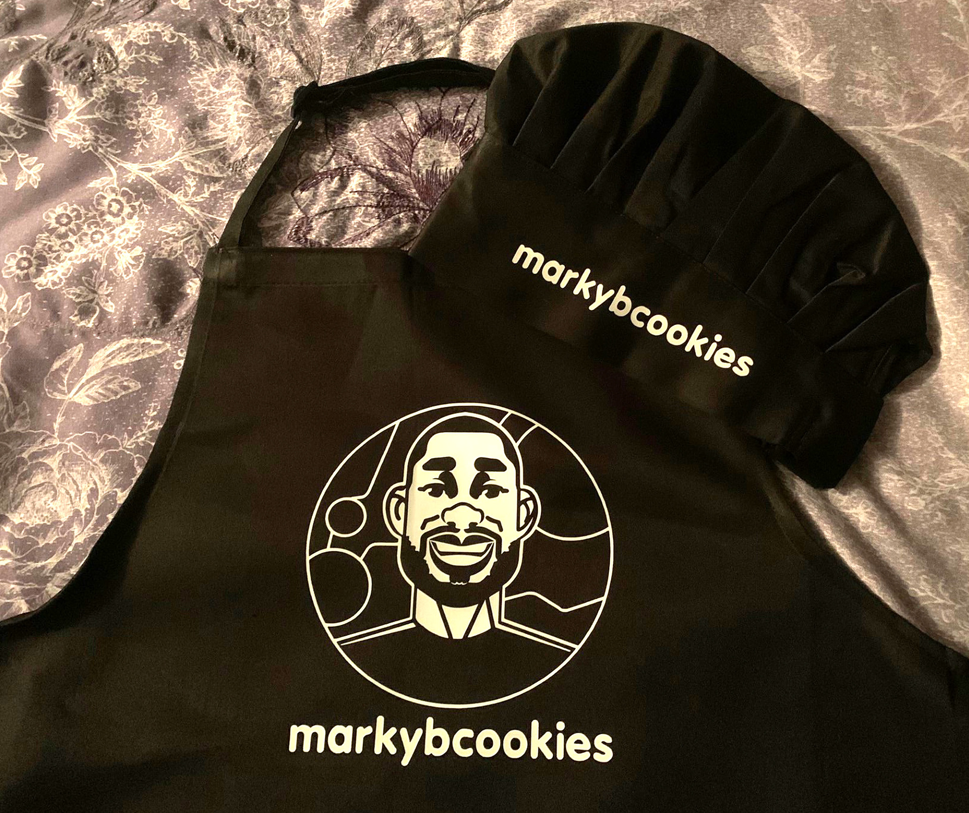 apron and chef hat on the bed