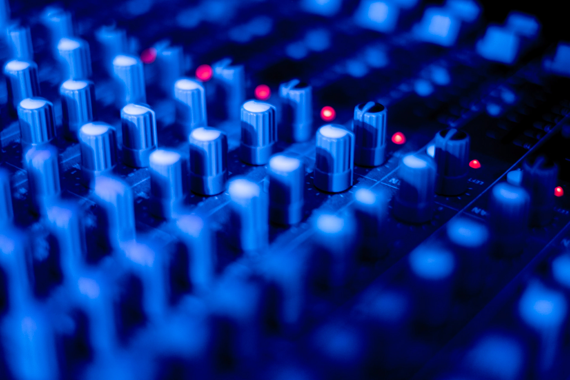 DJ mix board in blue light