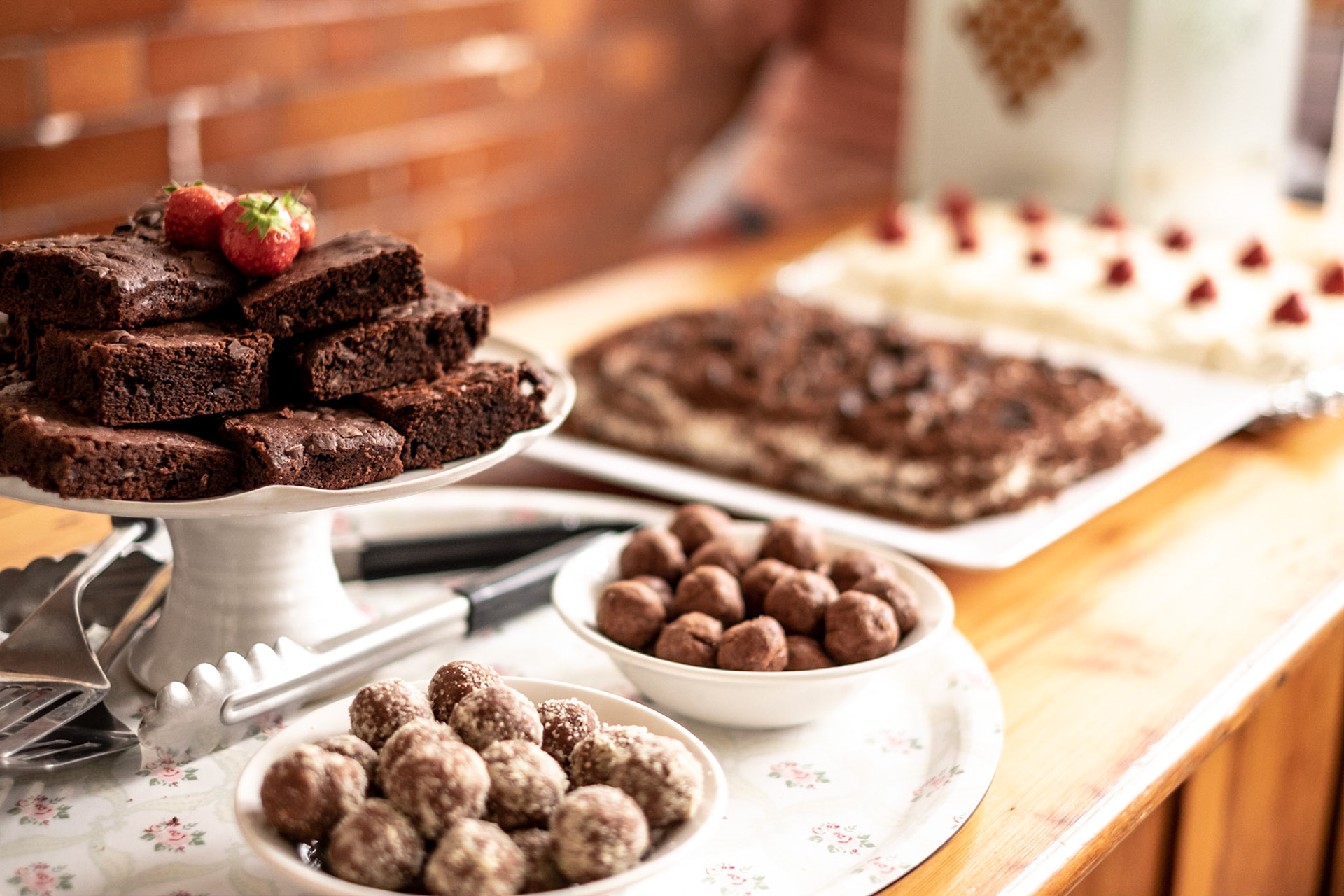 Brownies chocolate balls and cake on a wooden table ready for serving. Web: www.anthonywarner.co.uk Email: anthonywarner@gmail.com