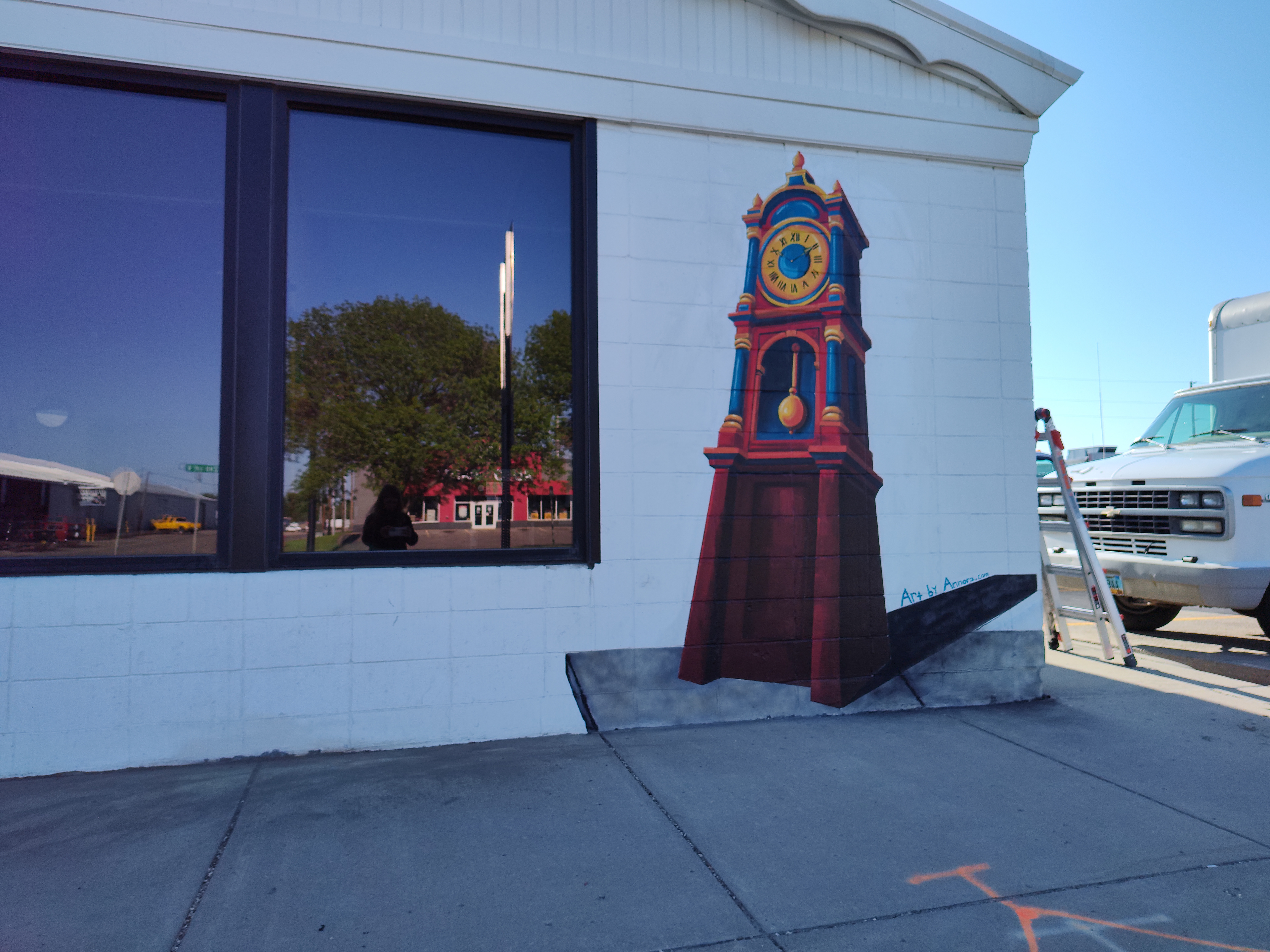 Grandfather clock mural at the front of the Second Opportunity ReStore