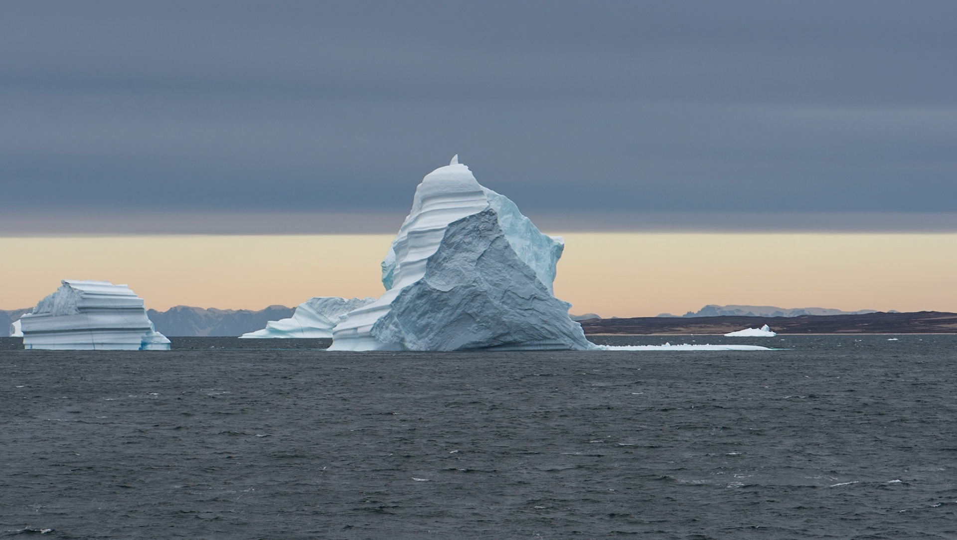 ©SVANA  Magnificent icebergs in Scoresby Sound, East Greenland, with differentshapes and colours. Somehow hard to imagine that only one tenth is abovethe water.