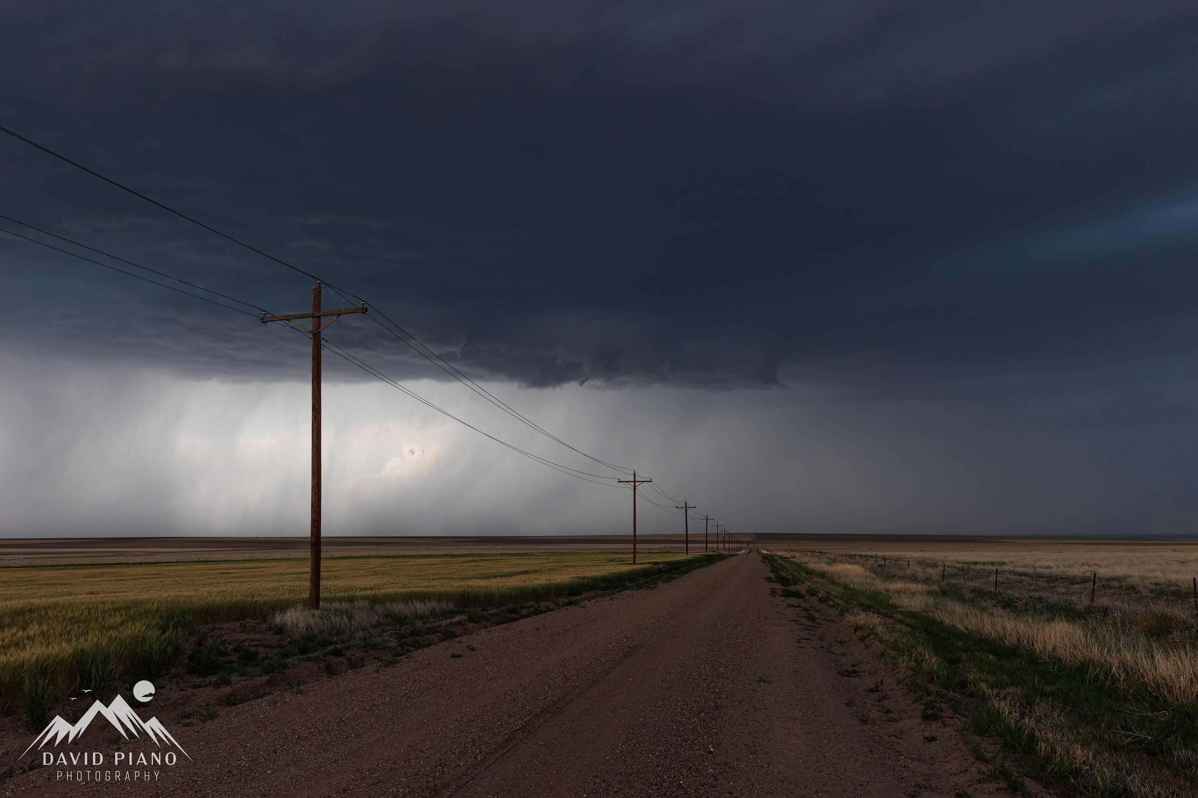 Small funnel emerges from the storm's base