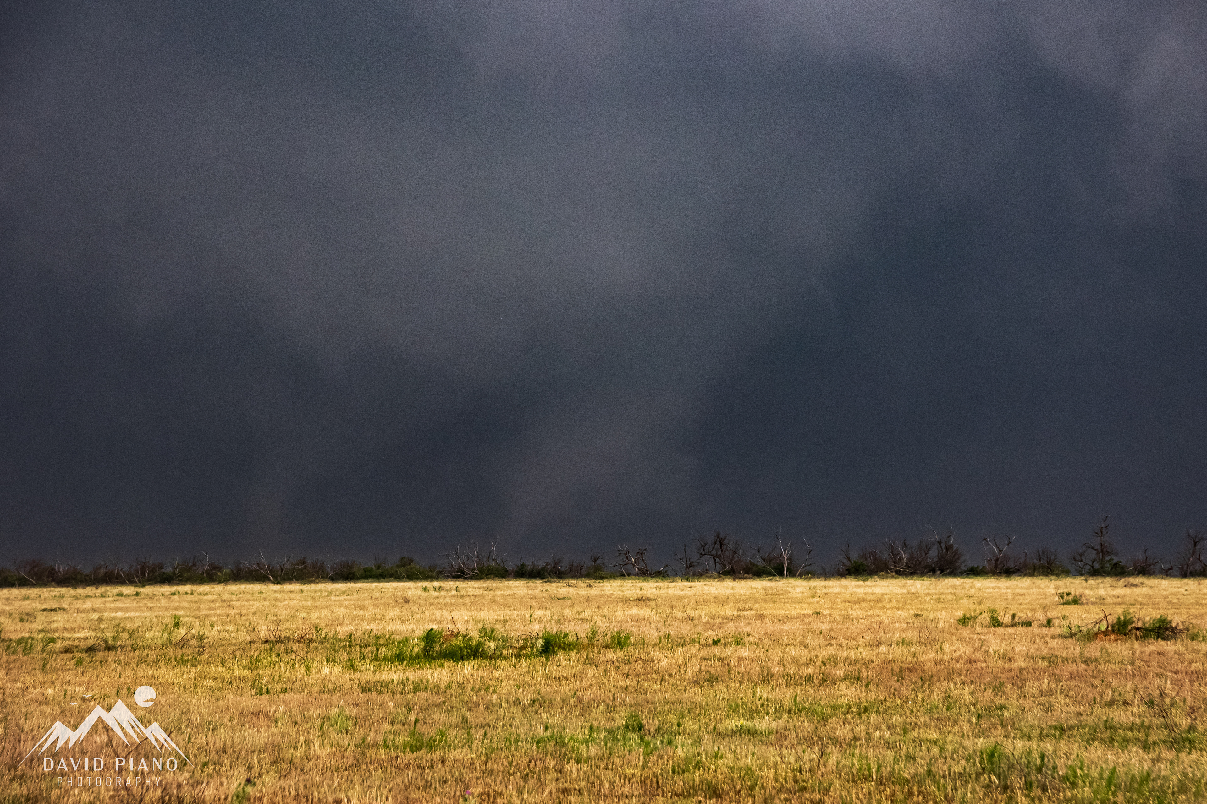 The tornado quickly grows into a huge multi-vortex wedge with a max width of over a mile wide