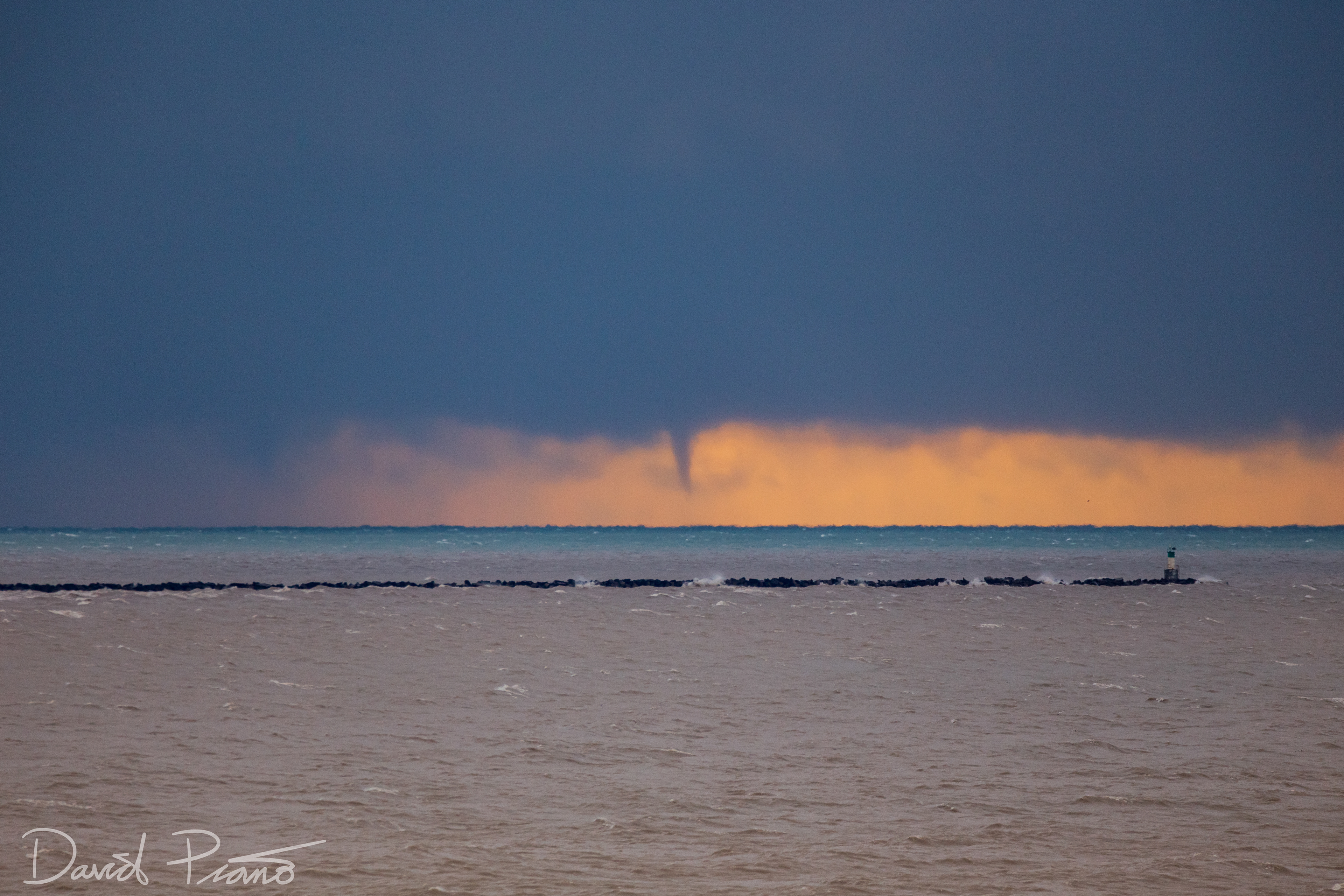 Sunrise waterspouts over Lake Erie seen from Port Burwell (twin spout to the left in the rain)