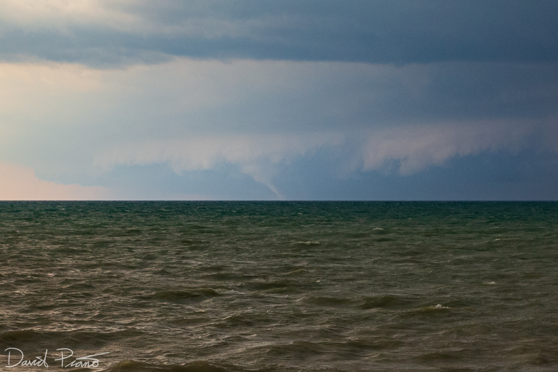 A white elephant trunk tornado develops over Lake Huron looking SSW from Point Clark