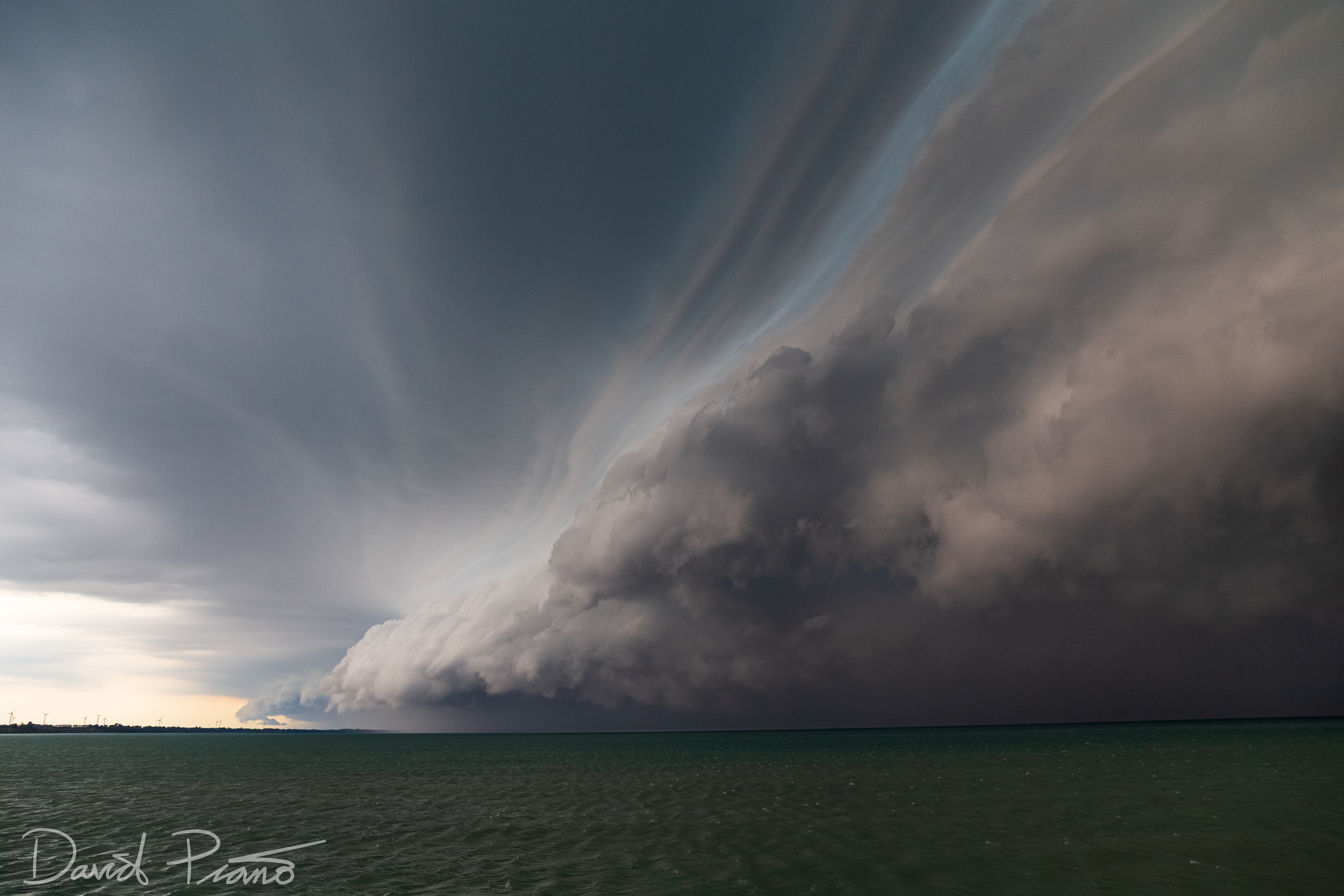 A wicked shelf cloud marks the leading edge of a severe squall line pushing off of Lake Huron into St. Joseph, ON - 07/20/2019