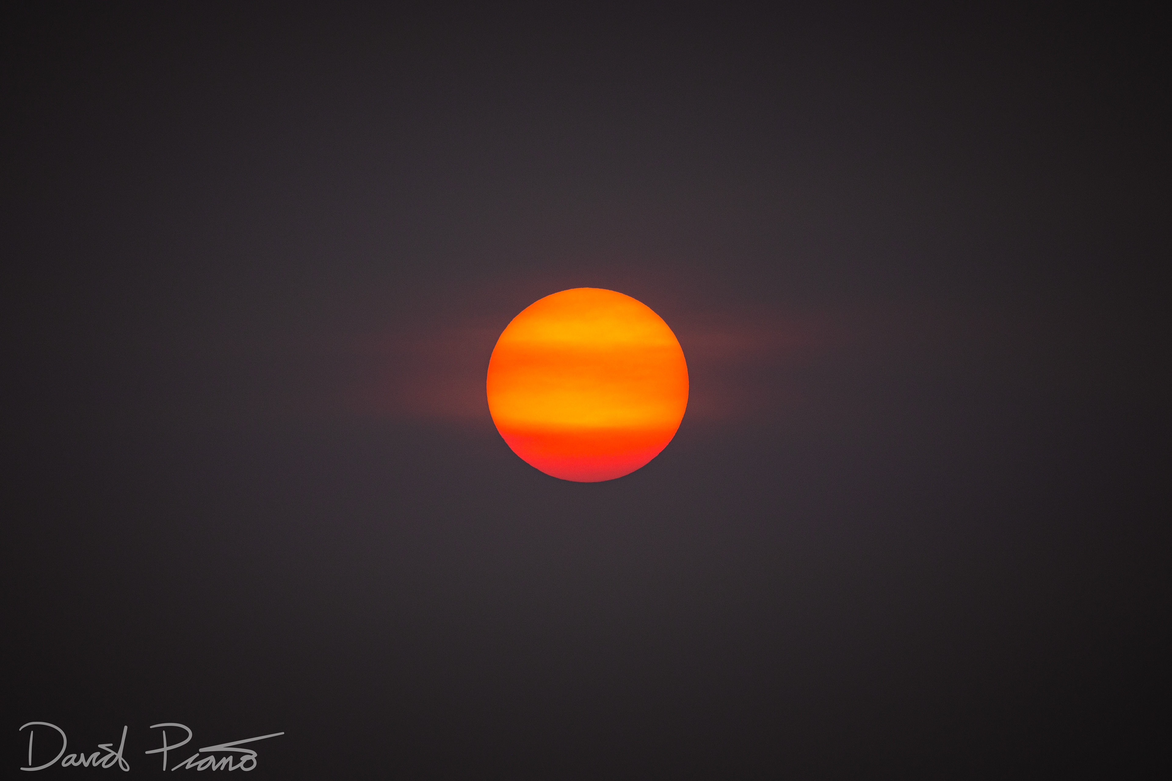 Smoke from fires in NW Canada blanketed Ontario and made the sun look a little more like Jupiter - 07/09/2019