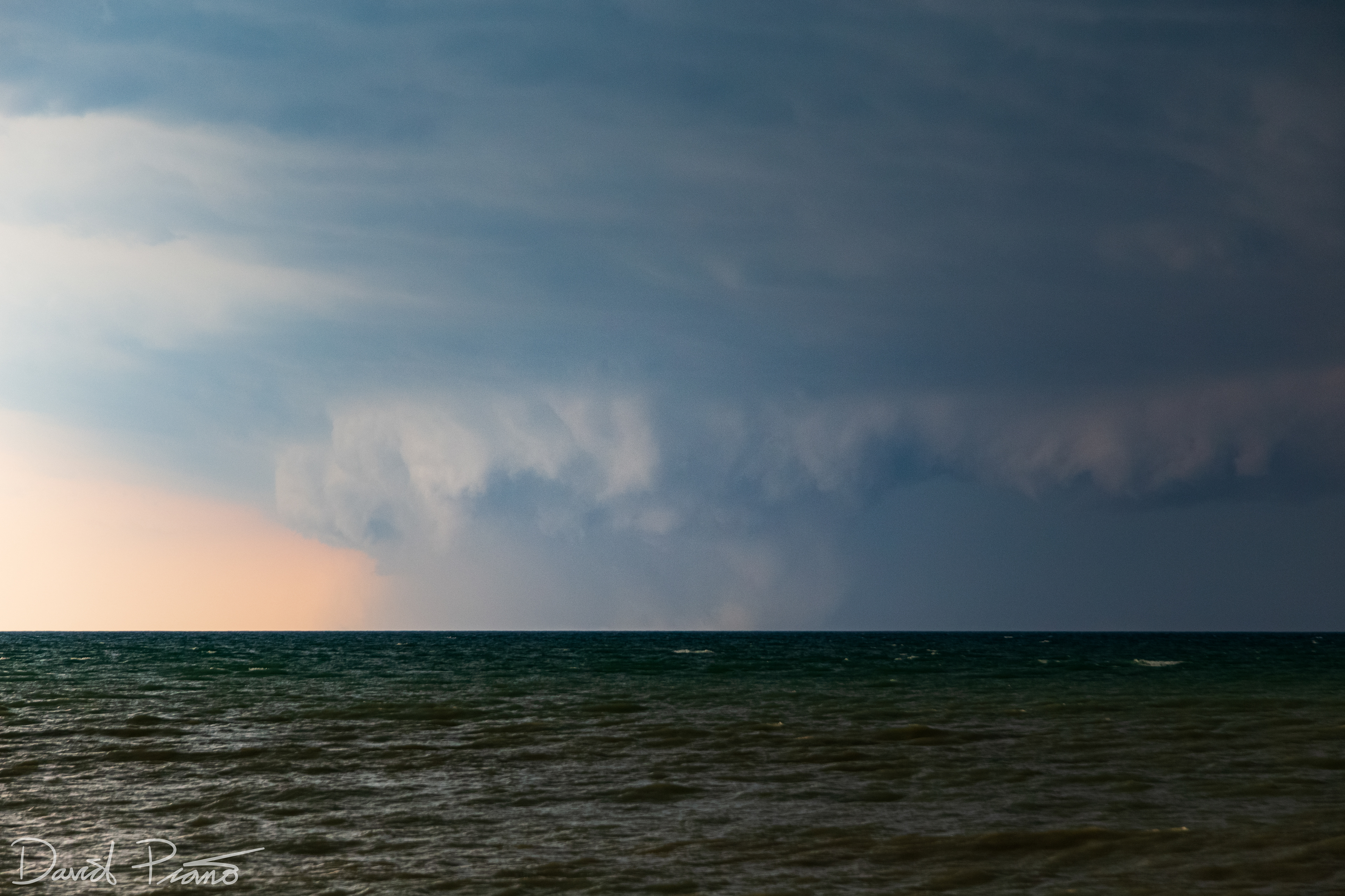The tornado grows in size and exhibits a multi-vortex structure over Lake Huron