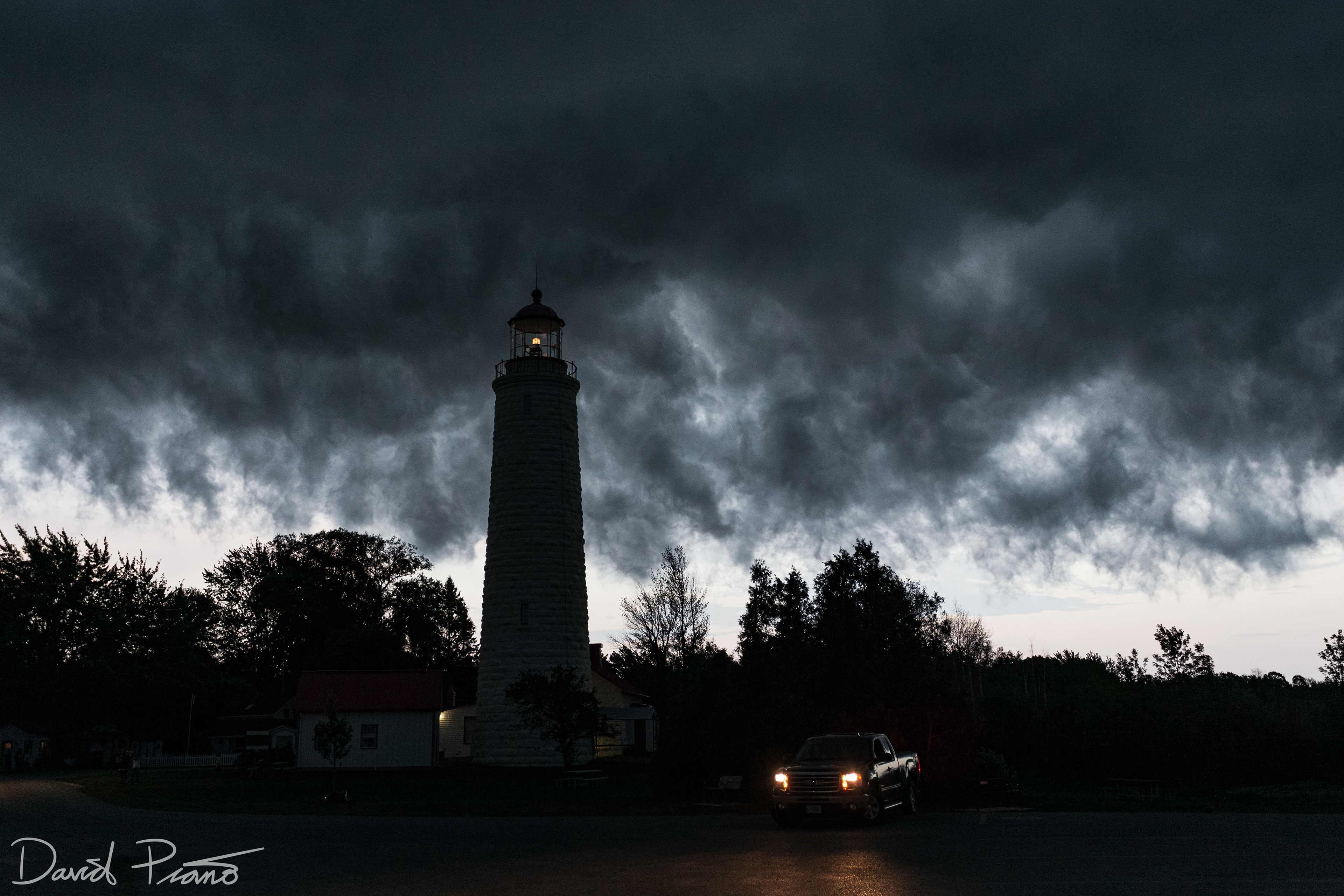 Point Clark Lighthouse in the "whale's mouth" of a strong thunderstorm