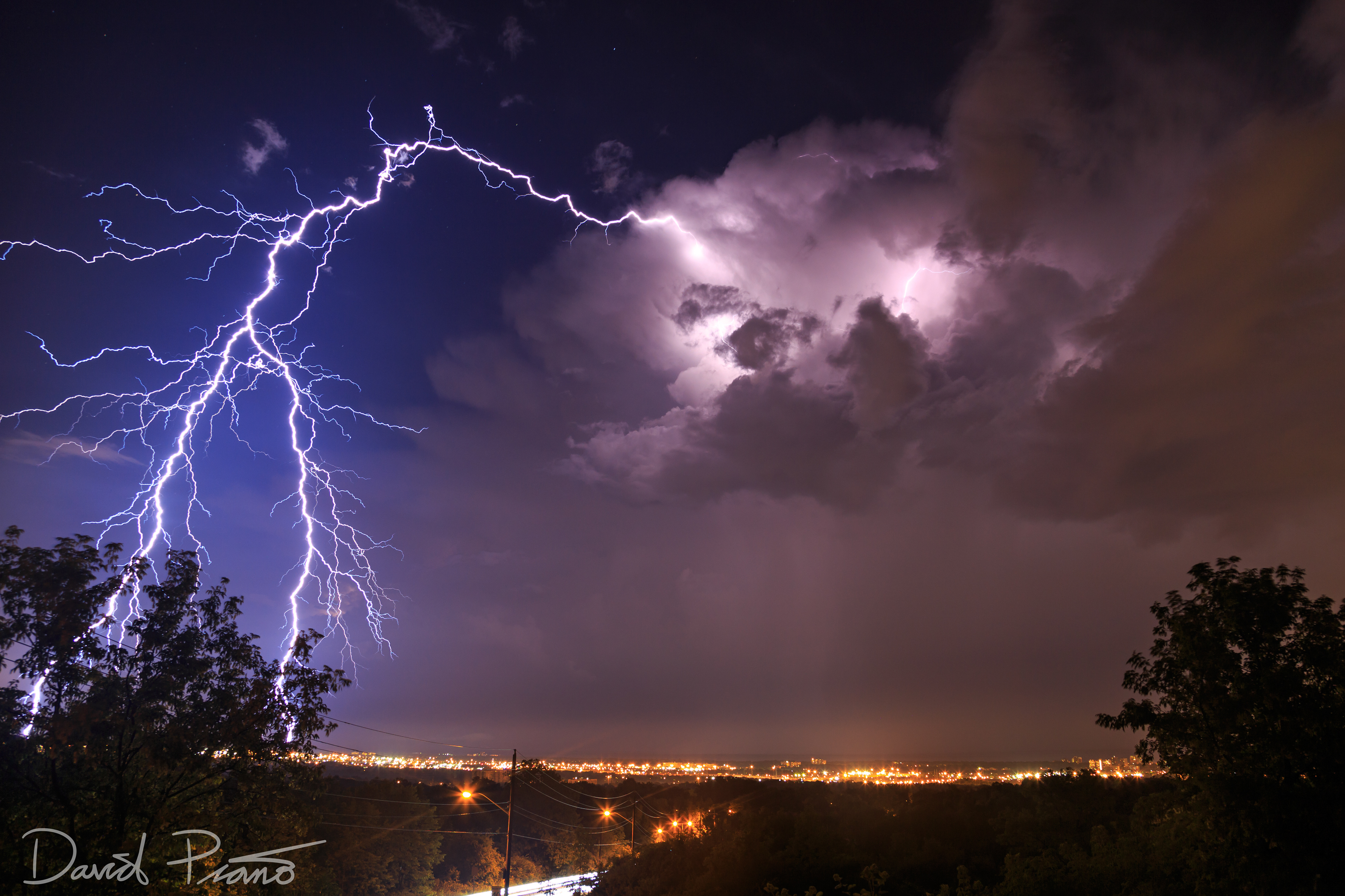 Insane clear-air CG lightning strike from anvil of thunderstorm over Hamilton, ON seen from Kern's Road Lookout in Burlington. This photo was used in correlation with the SOLMA lightning mapping array for research purposes. Taken on 07/ /2015