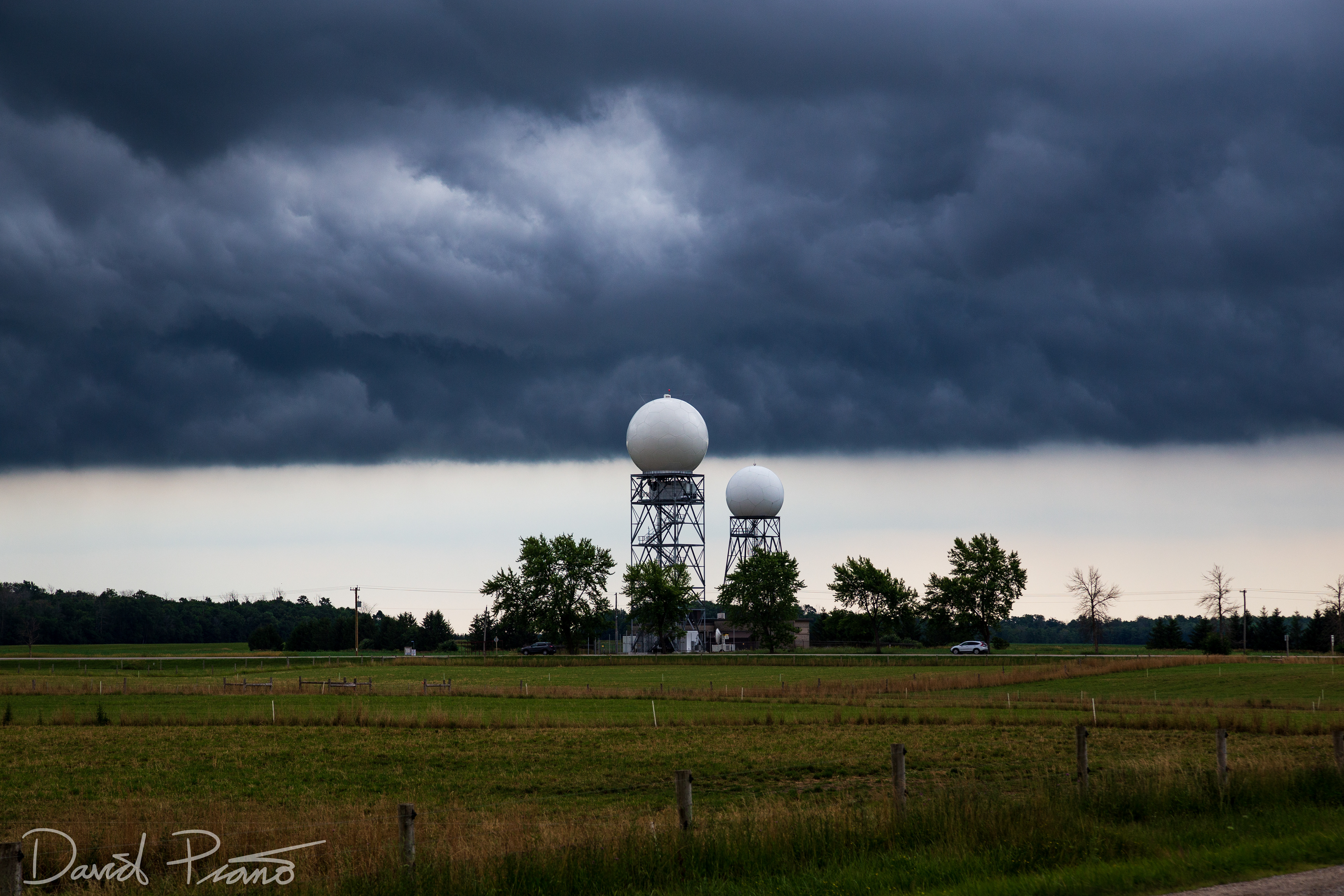 A shelf cloud passes over the new and old Exeter weather radars during the short time period both could be seen together - 07/19/2019