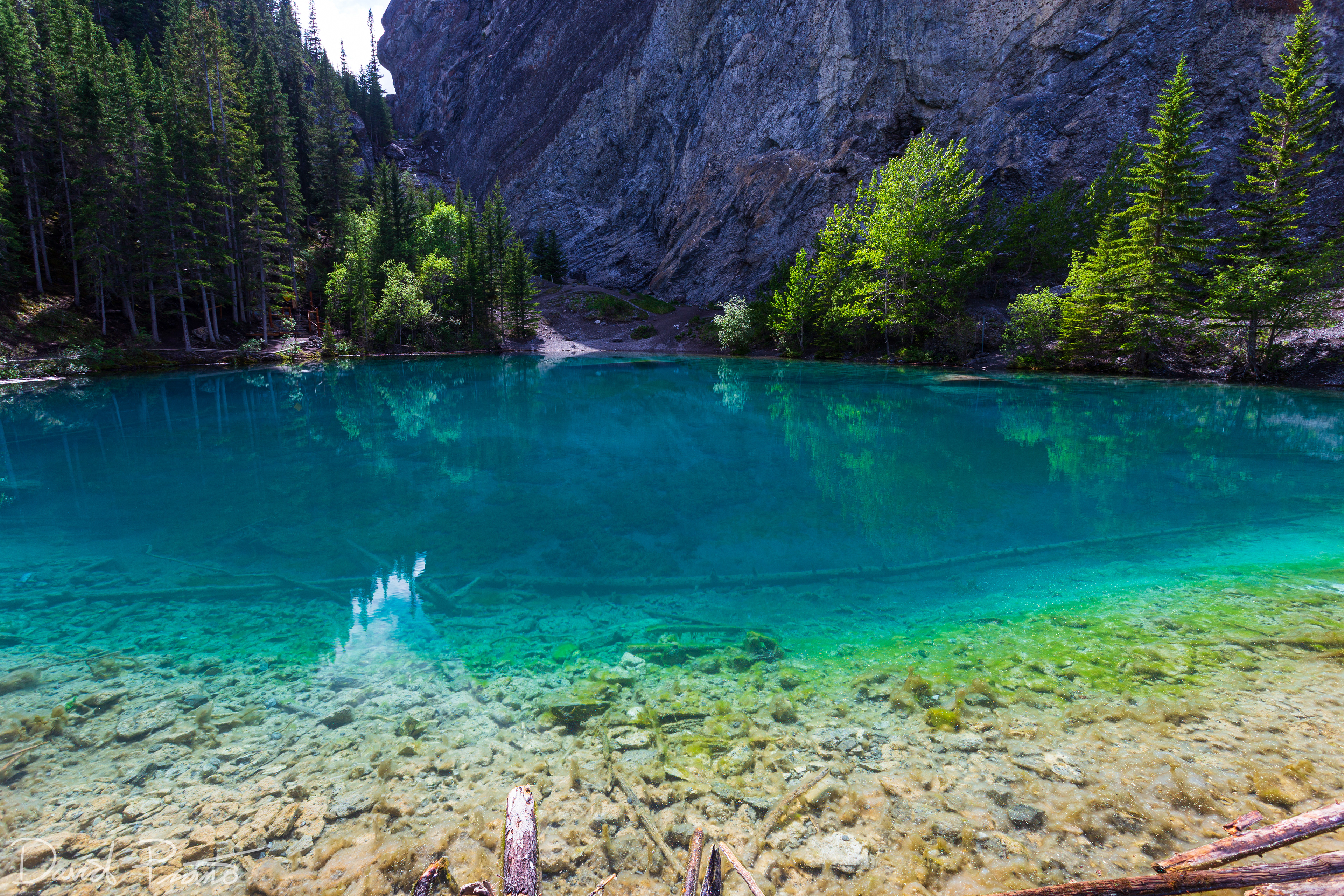 The crystal-clear emerald waters of the Grassi Lakes in Canmore, AB - June 2021