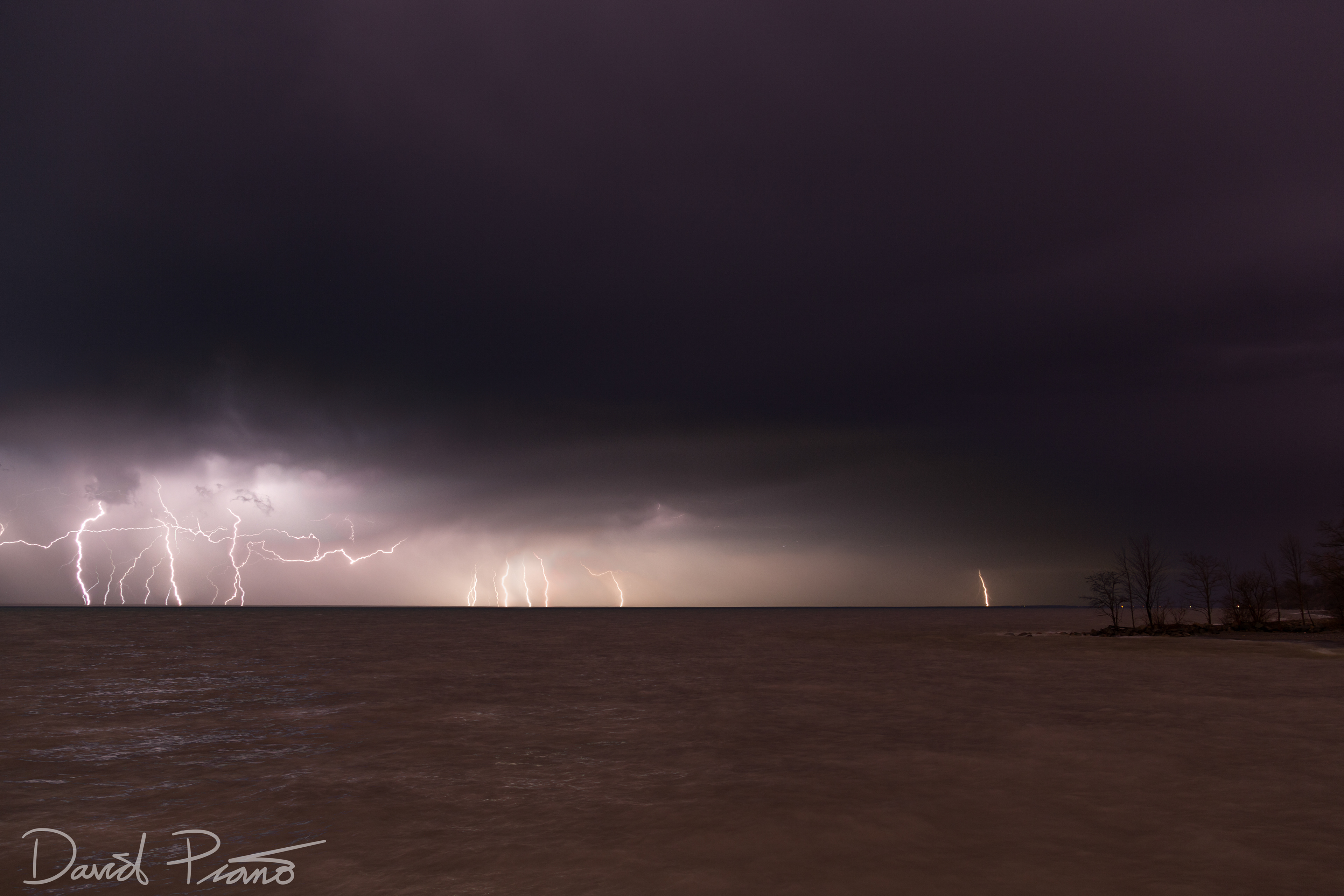 Numerous lightning strikes occur over Lake Erie during an early season thunderstorm - -