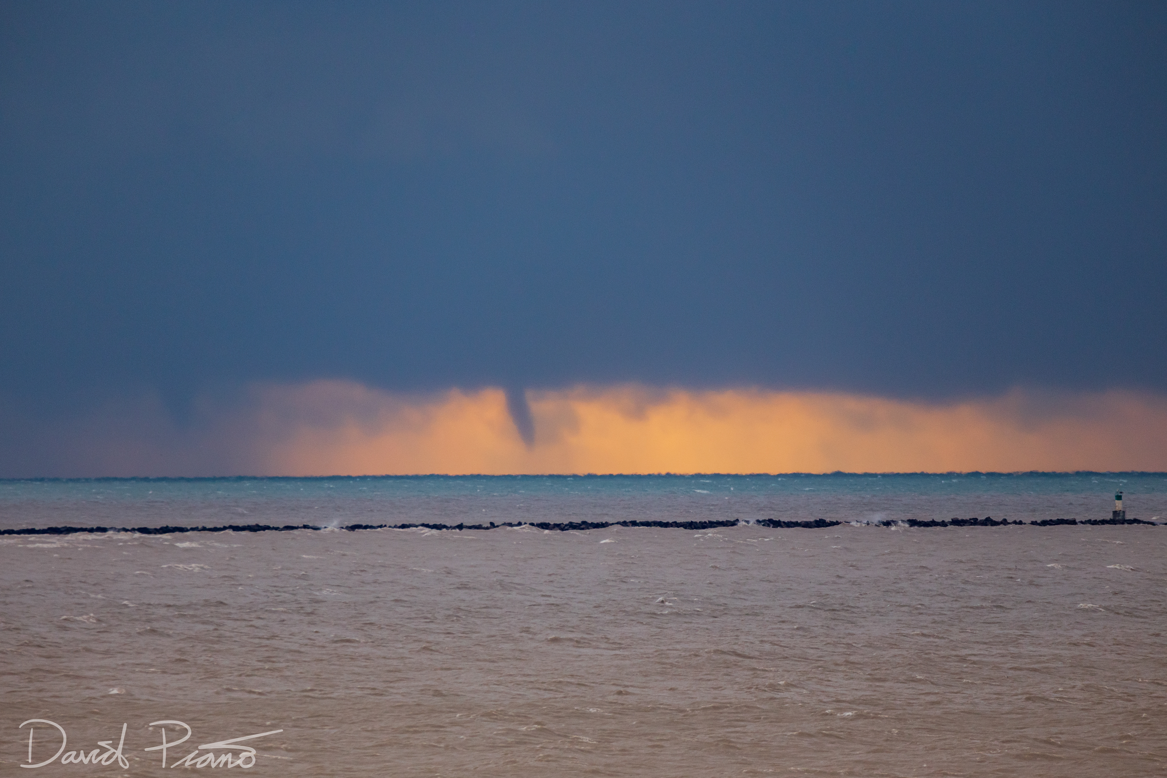 Sunrise waterspouts over Lake Erie seen from Port Burwell (twin spout to the left in the rain)