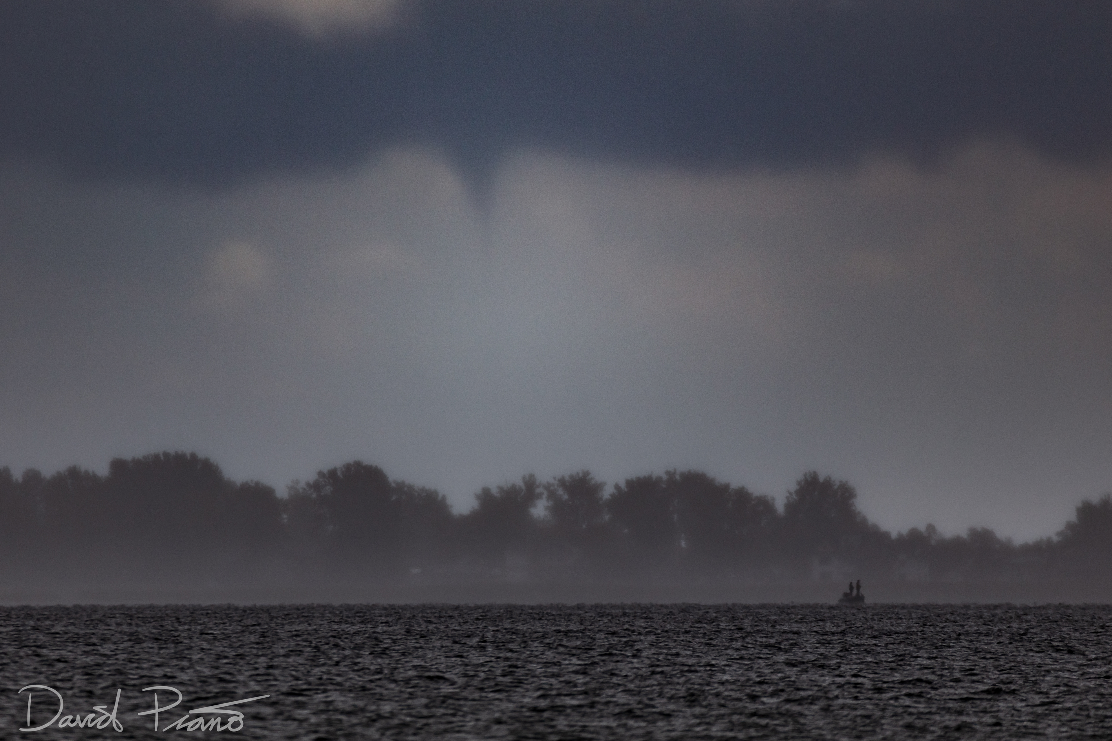 Waterspout funnel seen through curtains of rain from Port Rowan, ON -