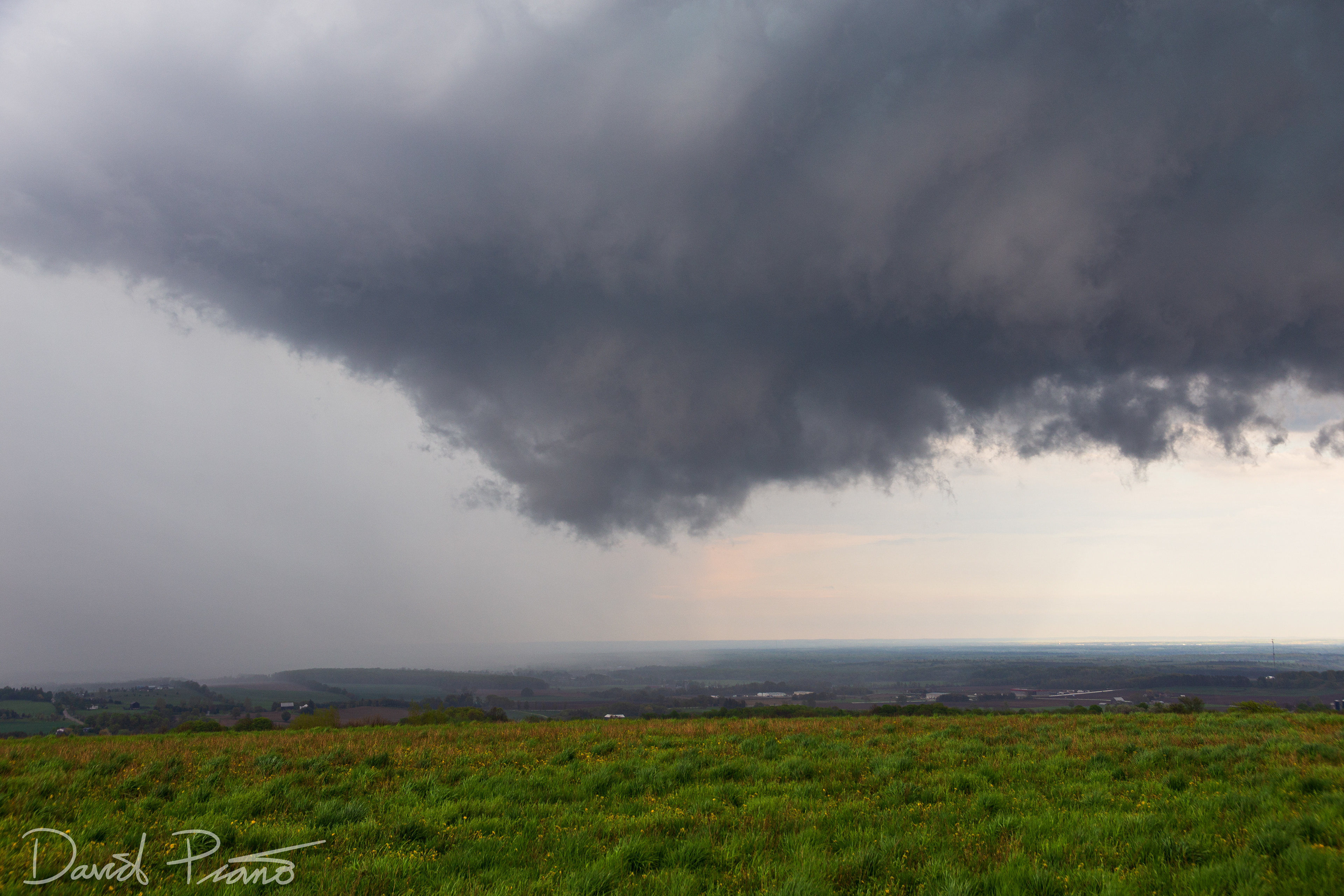 A wall cloud associated with a supercell is seen over Simcoe County from near Creemore - May 24