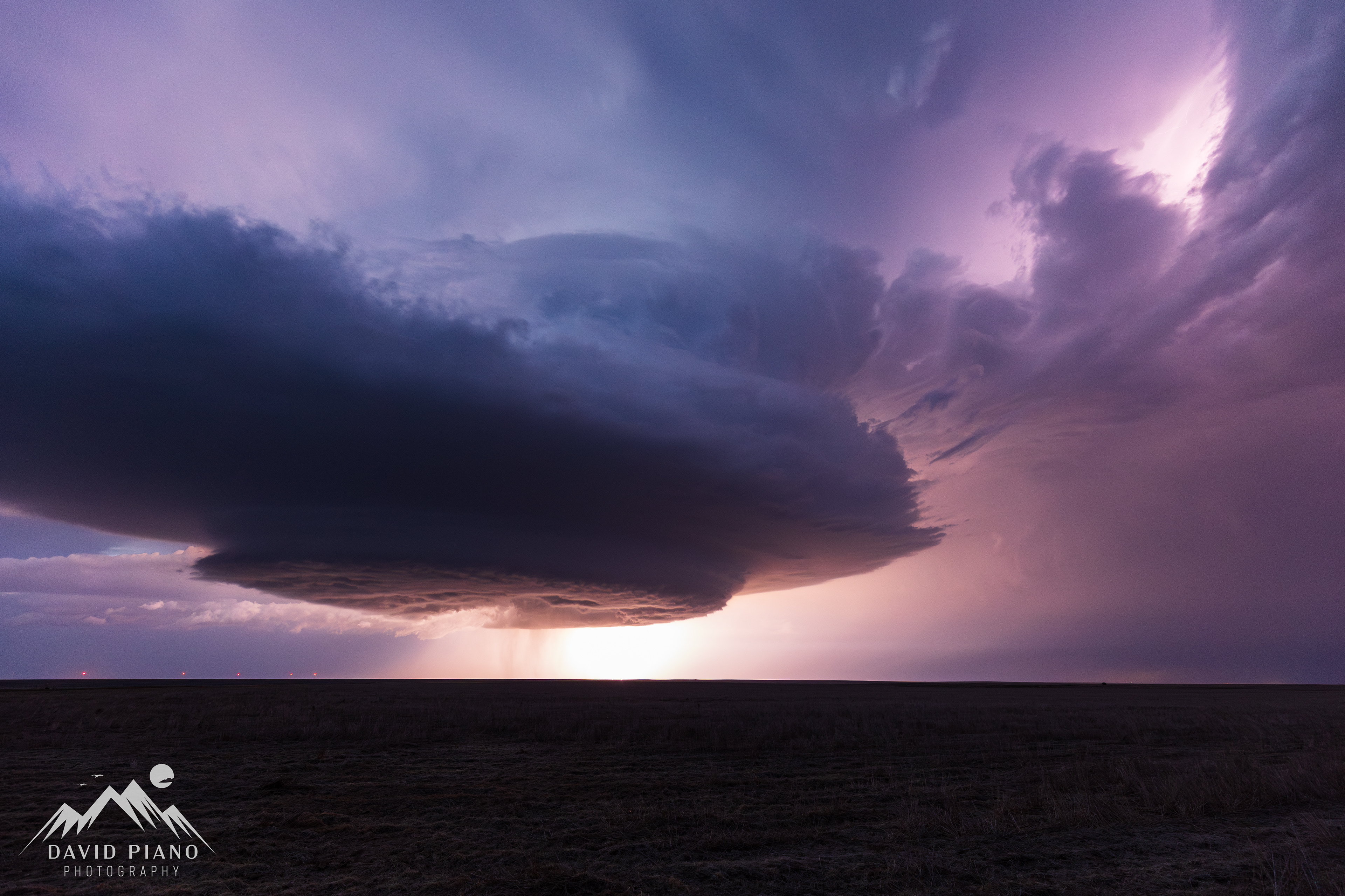 The supercell becomes a full-blown mothership after dark near Two Buttes, CO