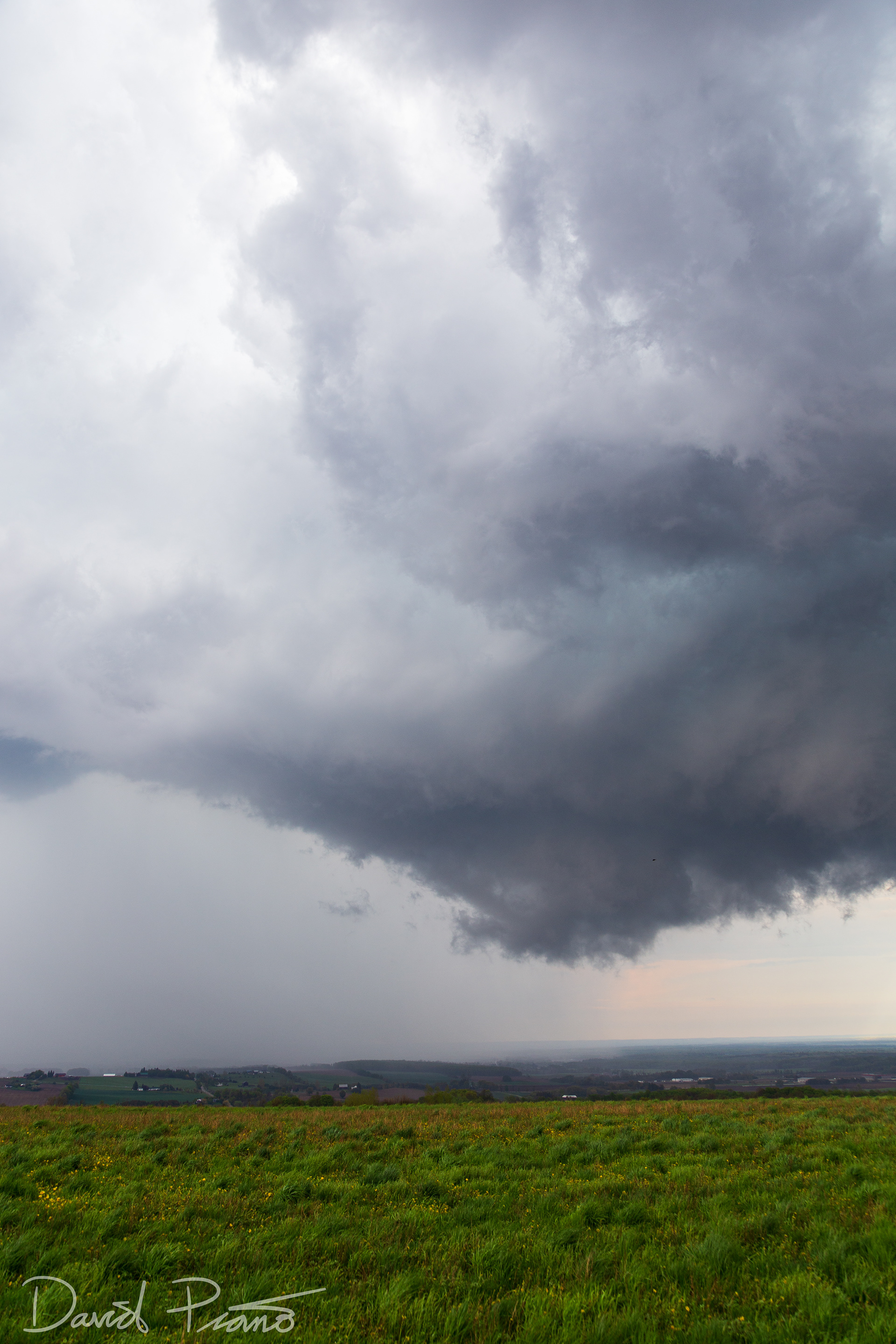 A wall cloud associated with a supercell is seen over Simcoe County from near Creemore - May 24