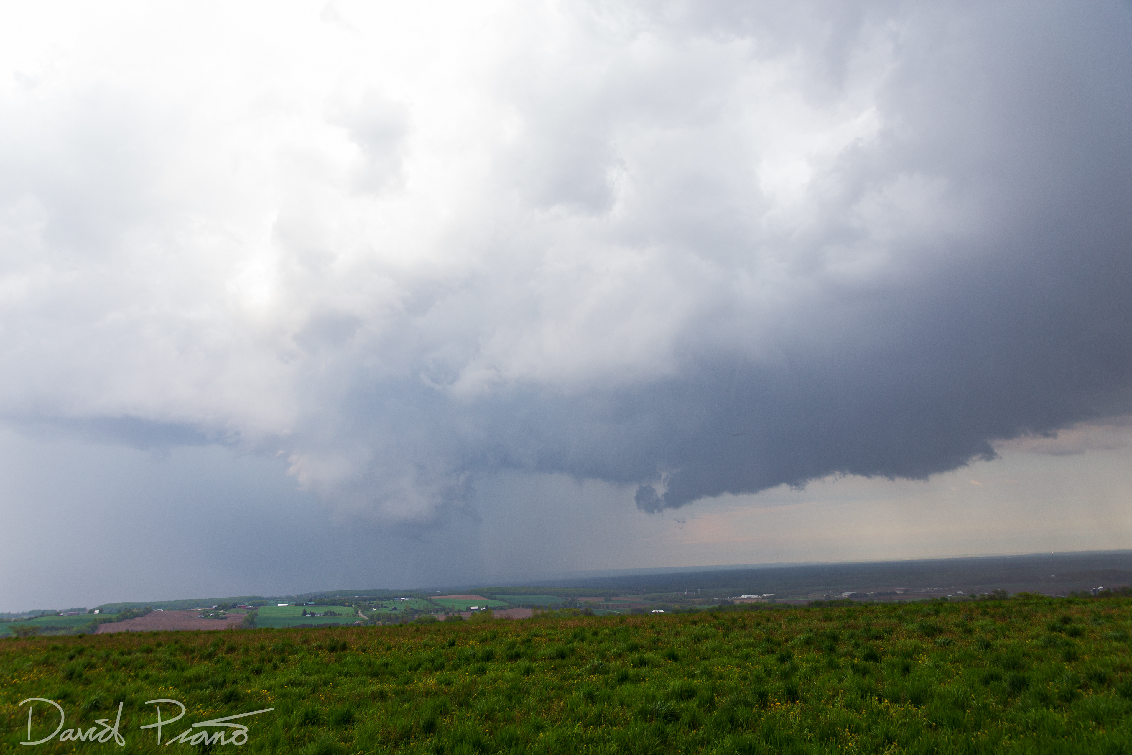 A wall cloud associated with a supercell is seen over Simcoe County from near Creemore - May 24