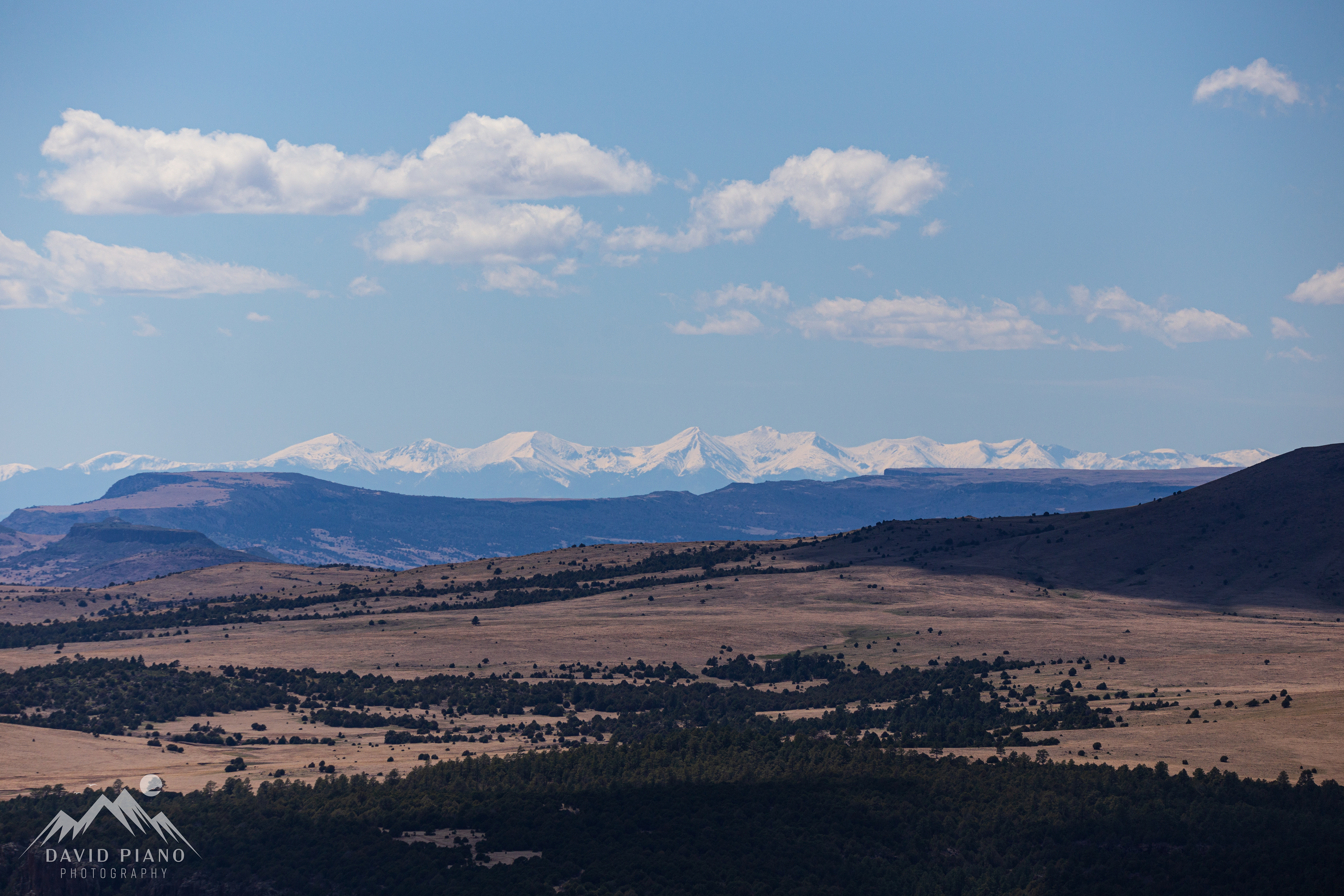 Snow-capped Rockies seen from the rim trail at Capulin Volcano