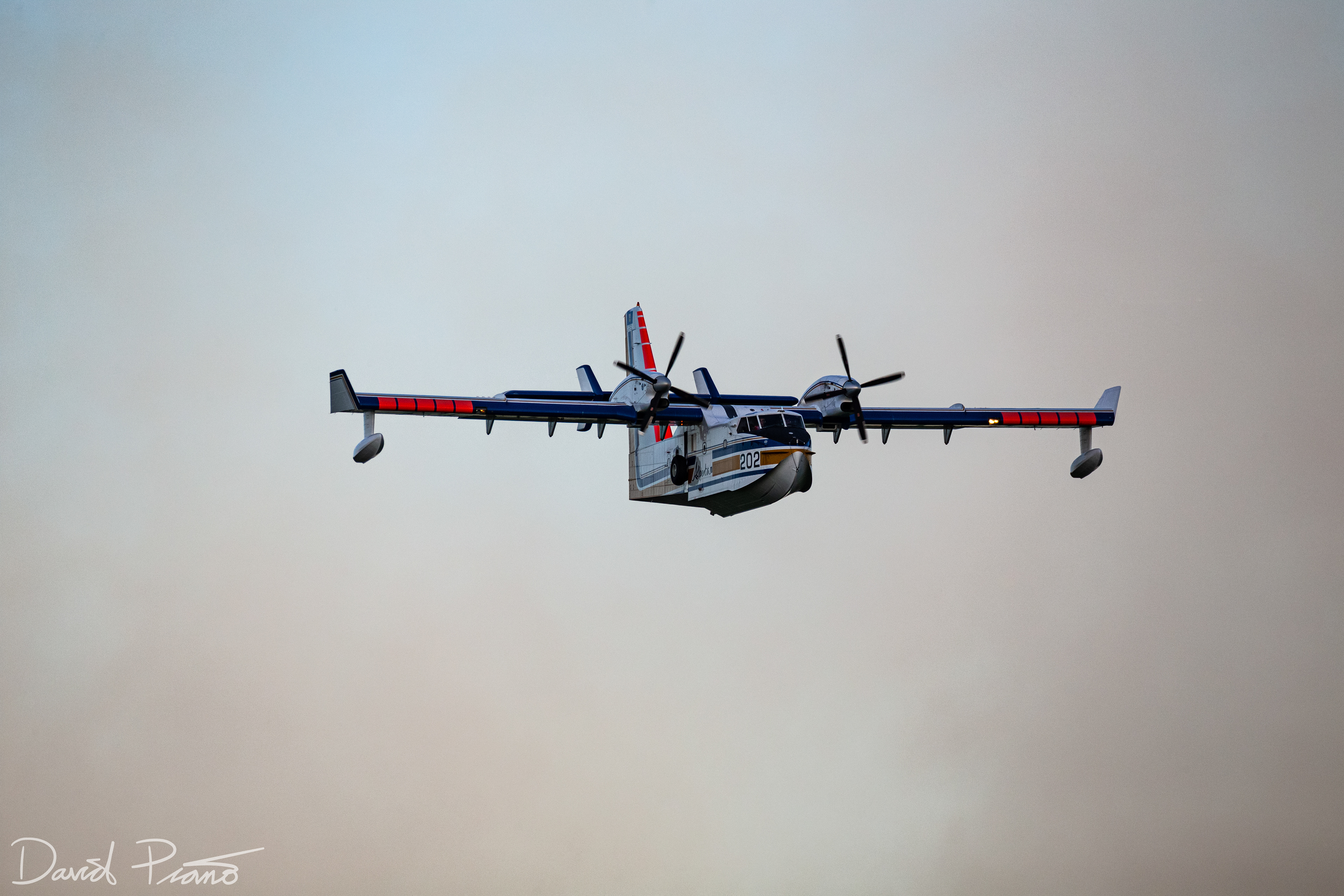 An Alberta CL-415 water bomber works to suppress a raging wildfire near the Yellowhead Highway in Alberta - June 2021