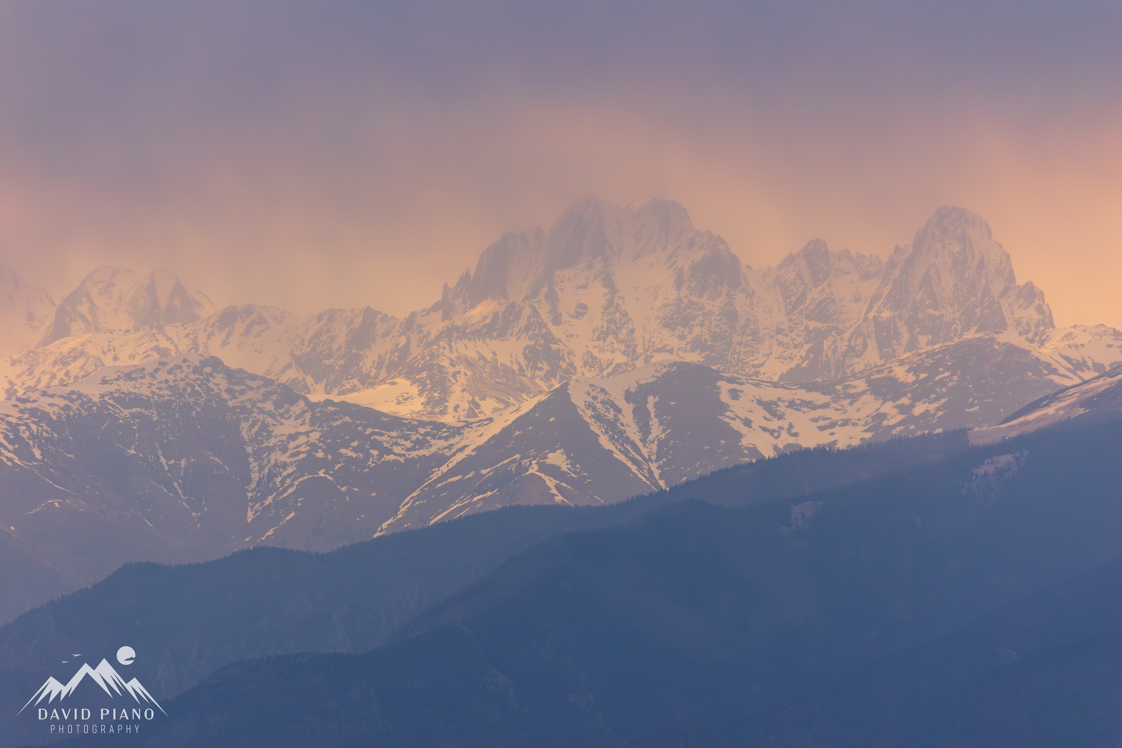 Sangre de Cristo Mountains at sunset with virga overhead