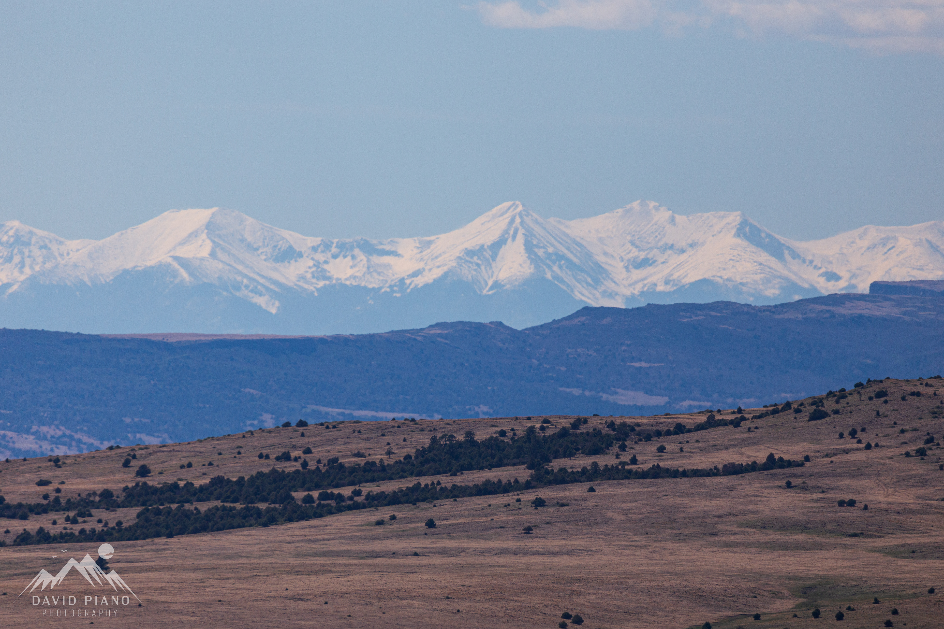 Snow-capped Rockies seen from the rim trail at Capulin Volcano