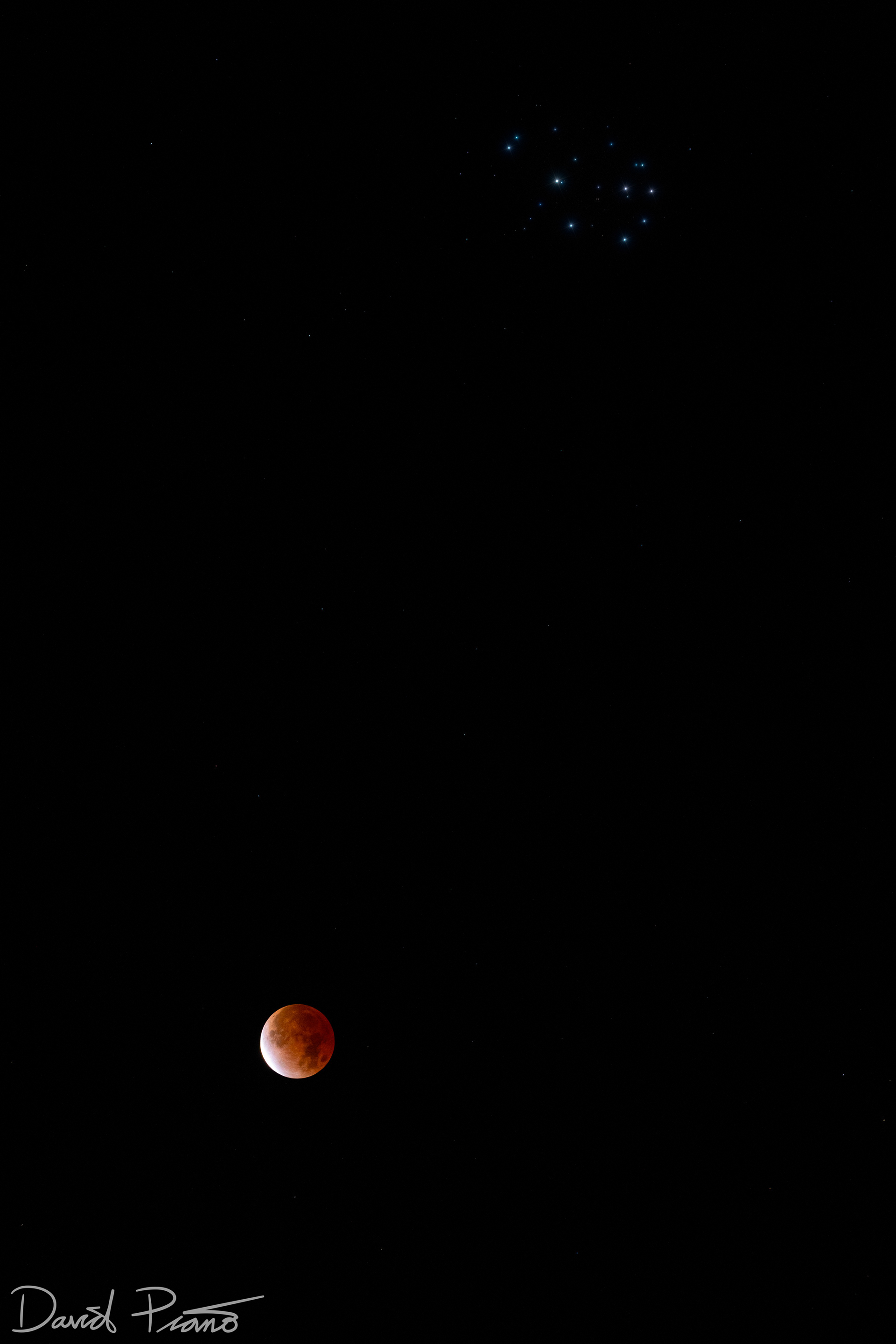 Lunar eclipse paired with the Pleiades star cluster - Nov. 19, 2021