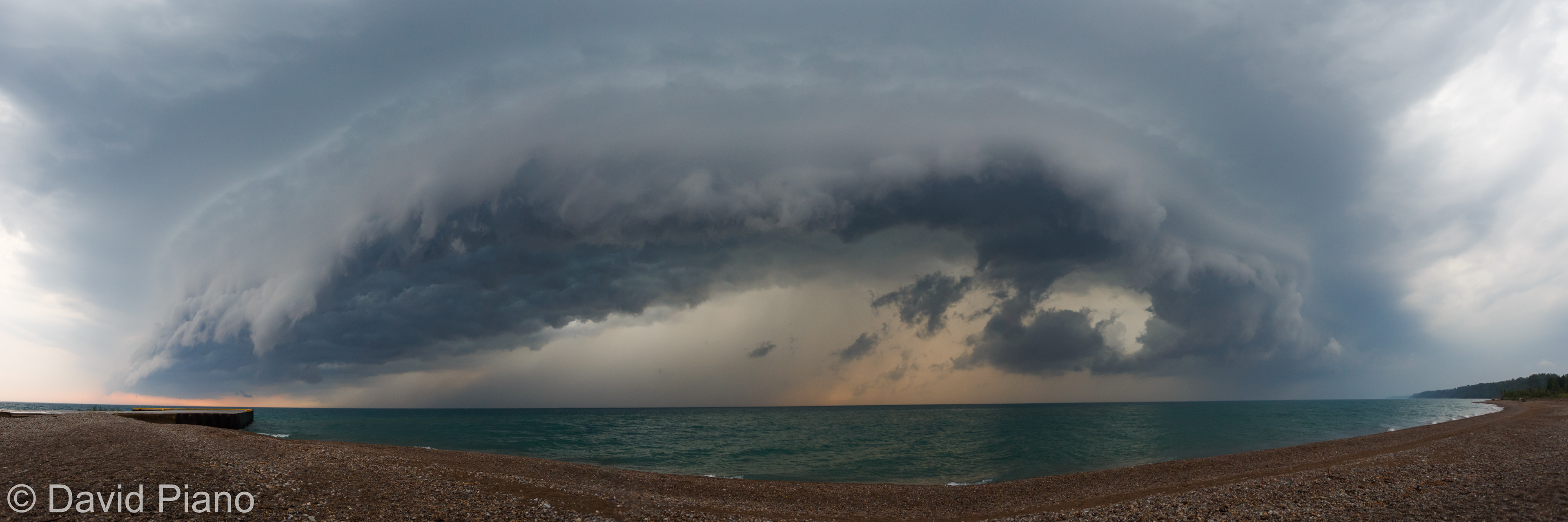A shelf cloud associated with a strong thunderstorm moves ashore at Bayfield - June 17, 2017