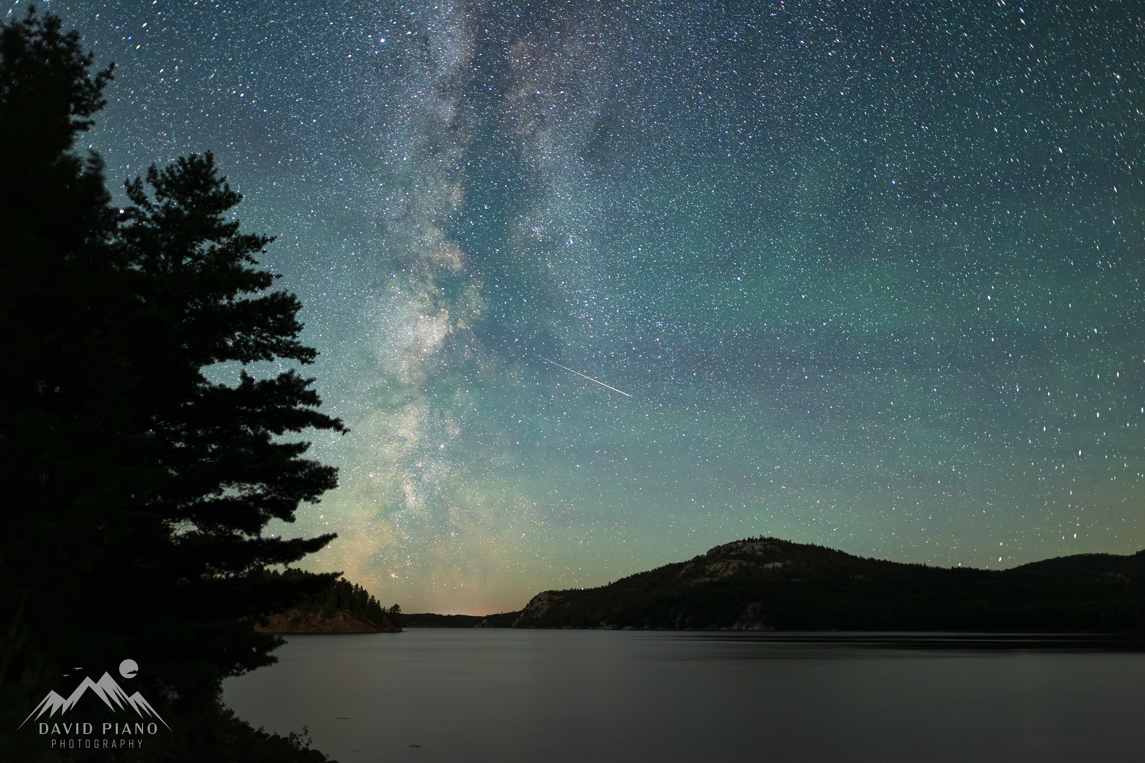 Milky Way over George Lake with a meteor - Aug. 2023