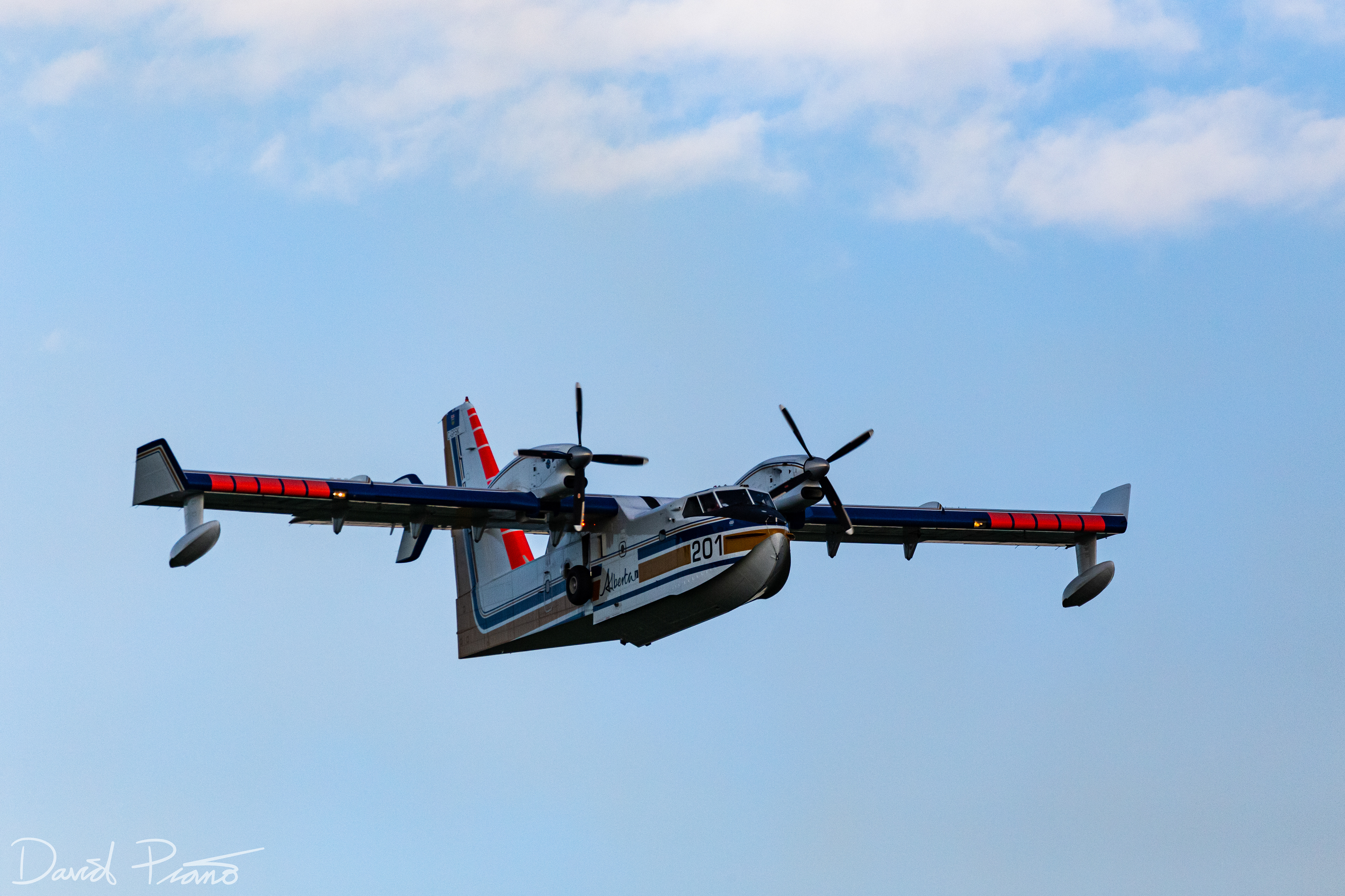 An Alberta CL-415 water bomber works to suppress a raging wildfire near the Yellowhead Highway in Alberta - June 2021