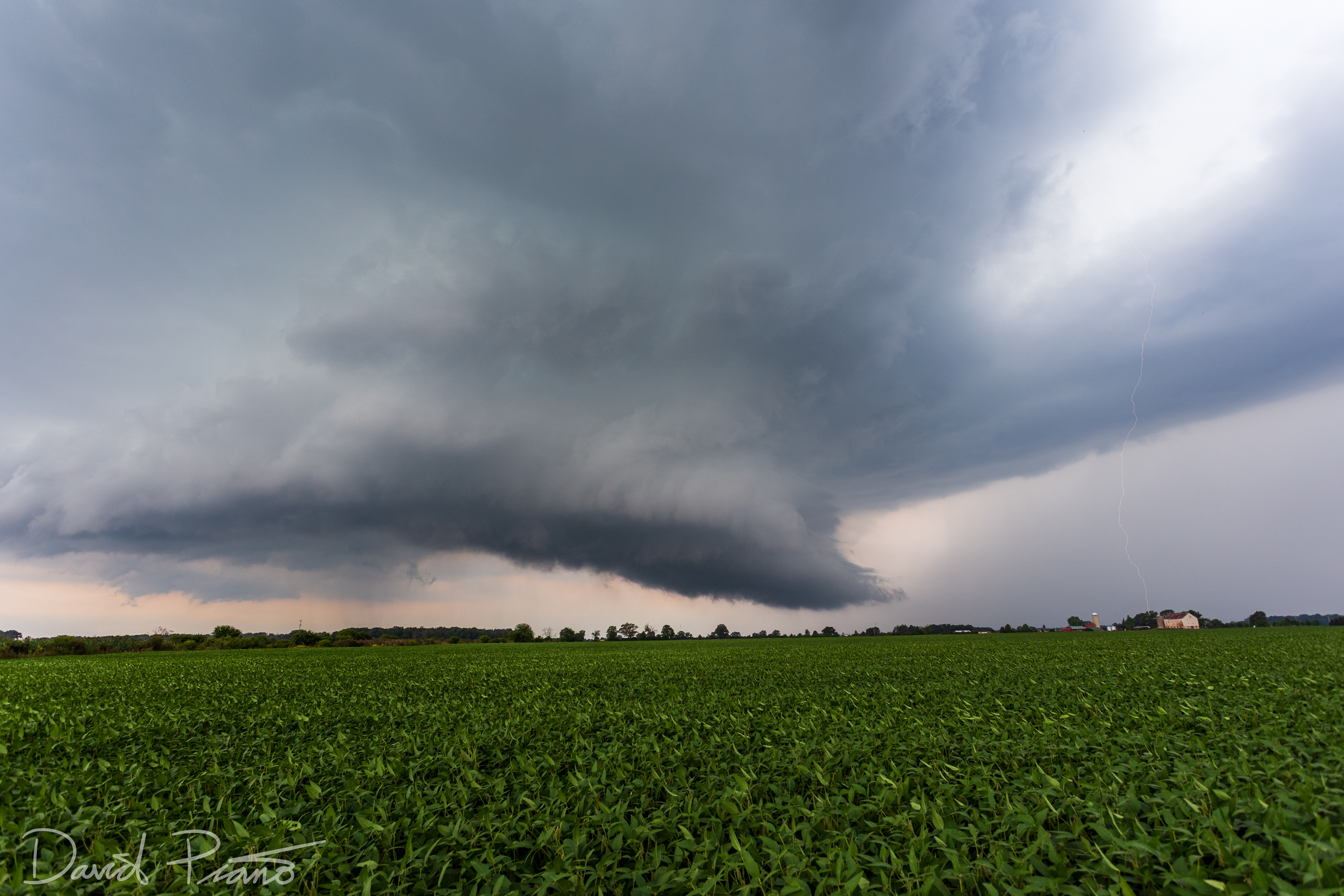 Impressive classic supercell moves across rural Lambton County, ON - 09/11/2019 (CG lightning bolt visible right of wall cloud)