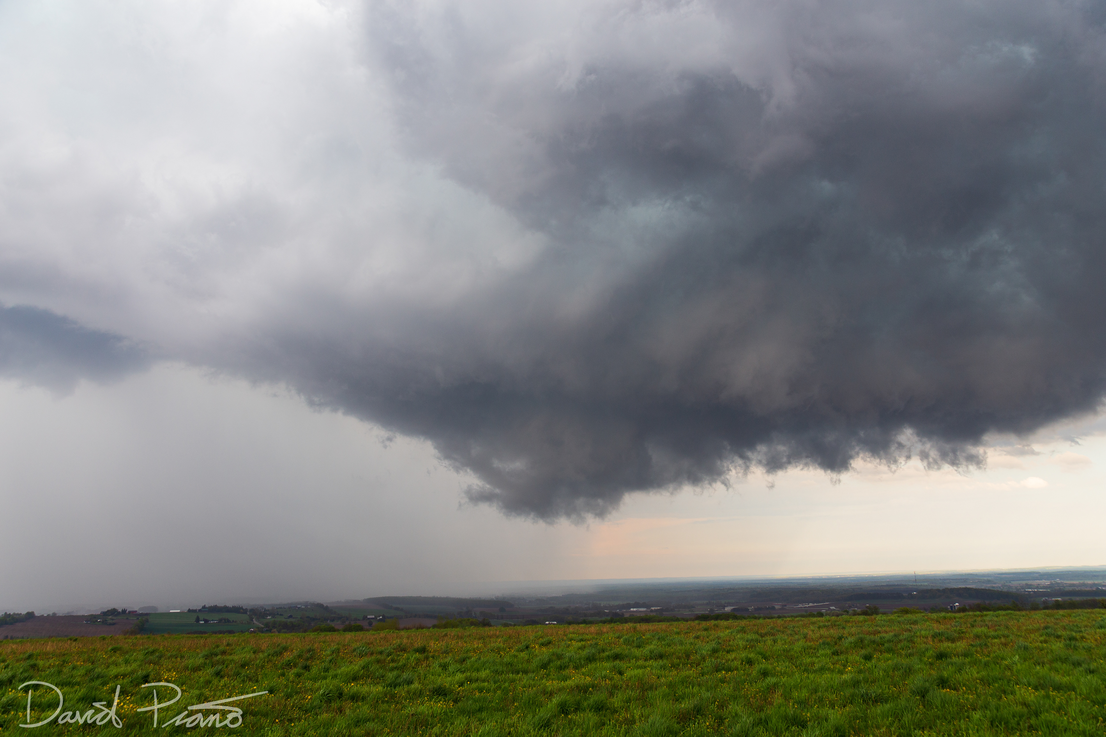 A wall cloud associated with a supercell is seen over Simcoe County from near Creemore - May 24