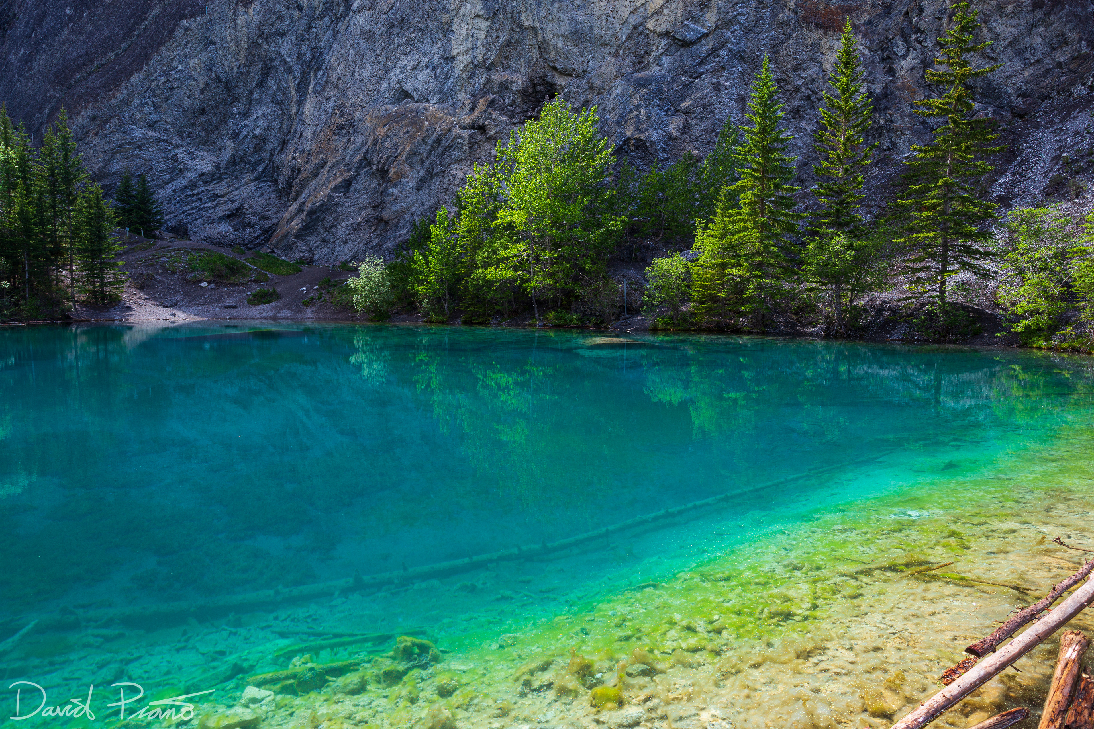 The crystal-clear emerald waters of the Grassi Lakes in Canmore, AB - June 2021