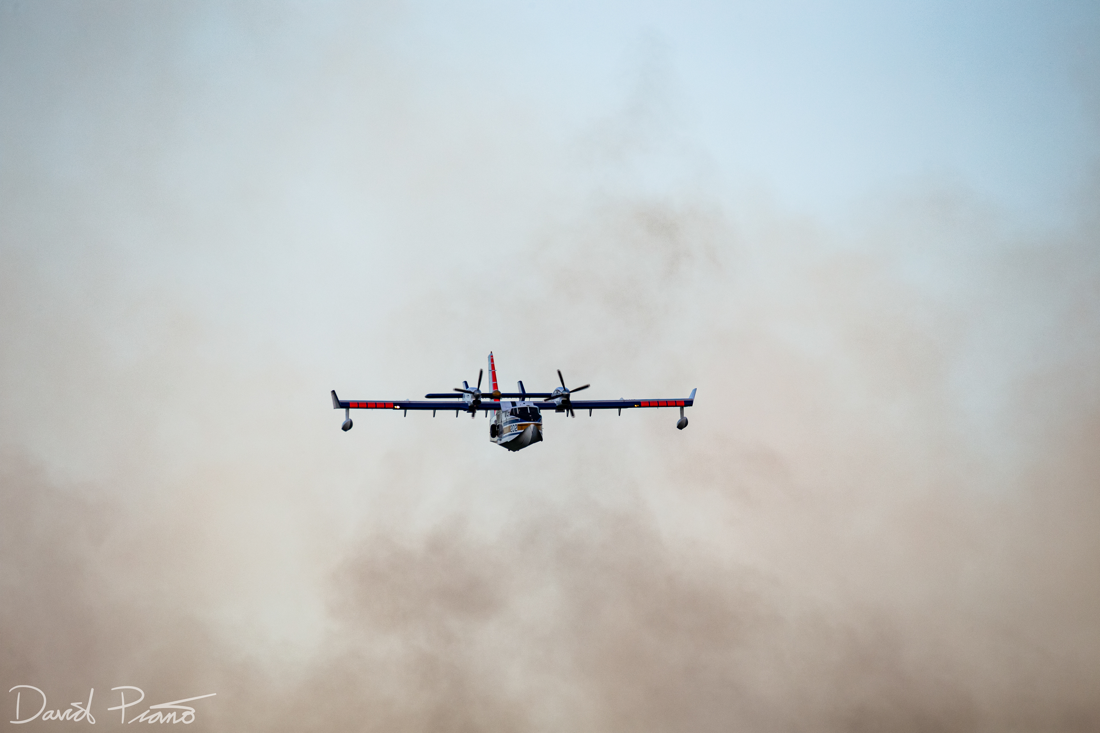An Alberta CL-415 water bomber works to suppress a raging wildfire near the Yellowhead Highway in Alberta - June 2021