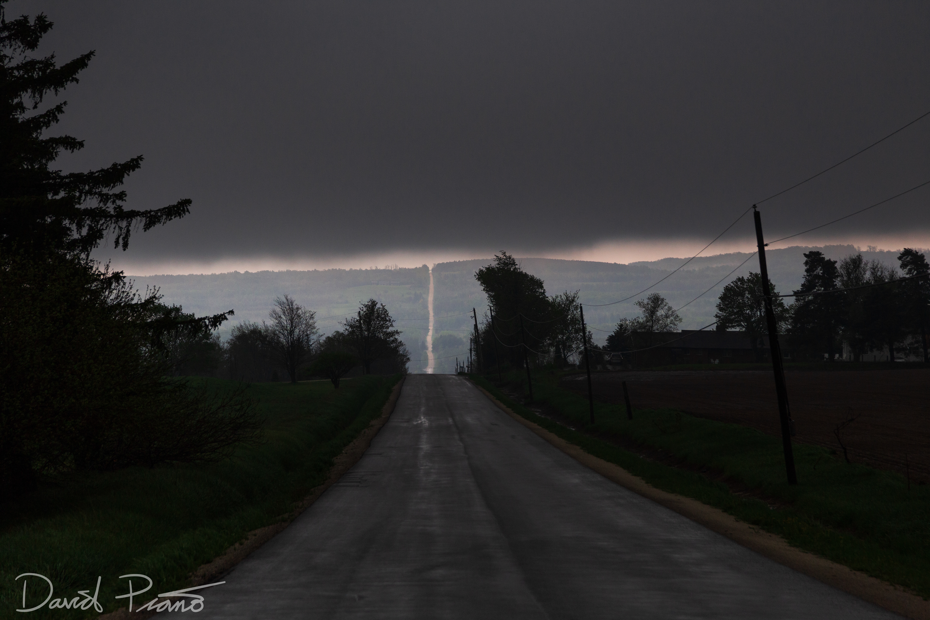 The base of a supercell thunderstorm hugs the top of the Niagara Escarpment near Creemore - May 24