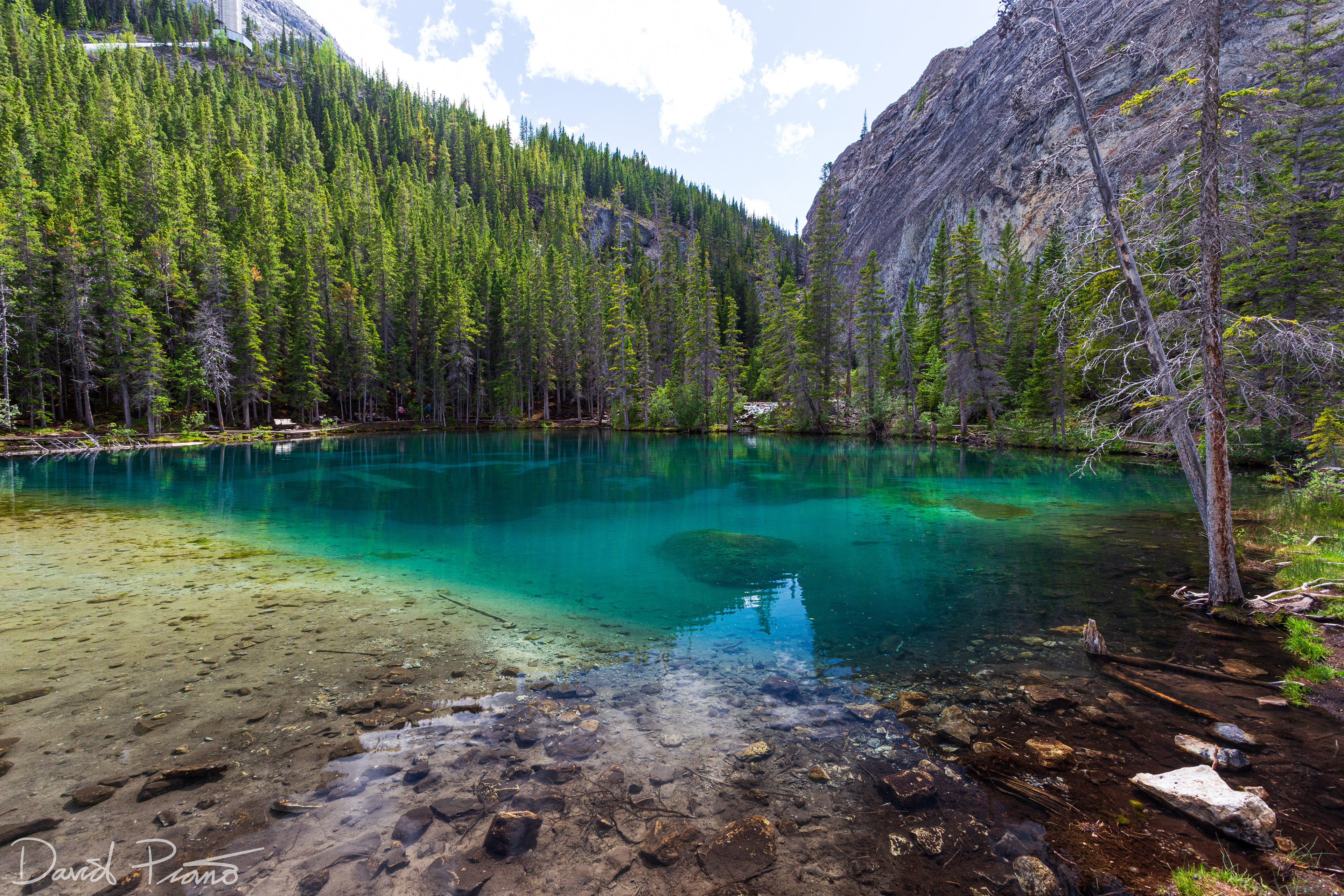 The crystal-clear emerald waters of the Grassi Lakes in Canmore, AB - June 2021