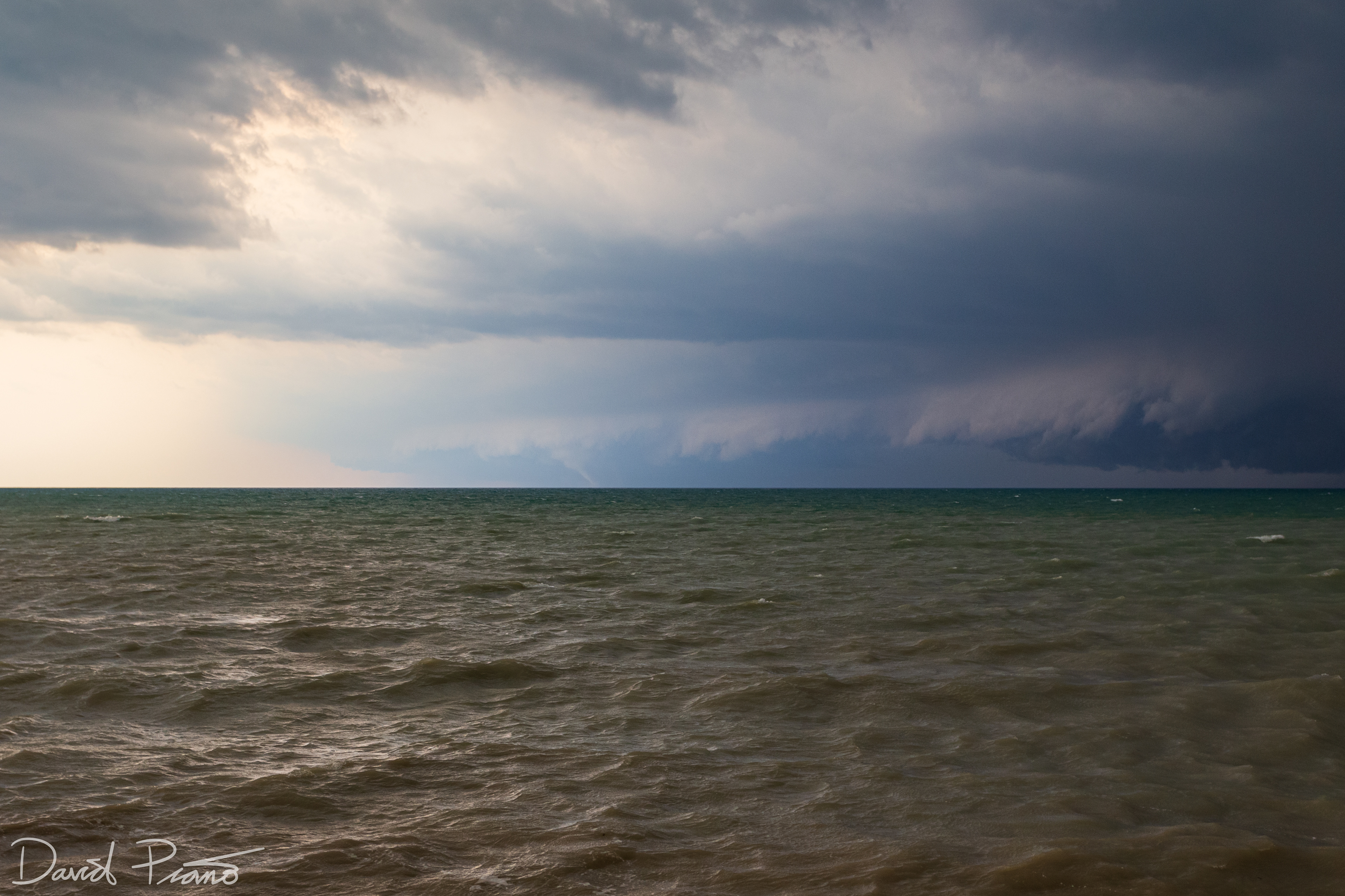 A white elephant trunk tornado develops over Lake Huron looking SSW from Point Clark