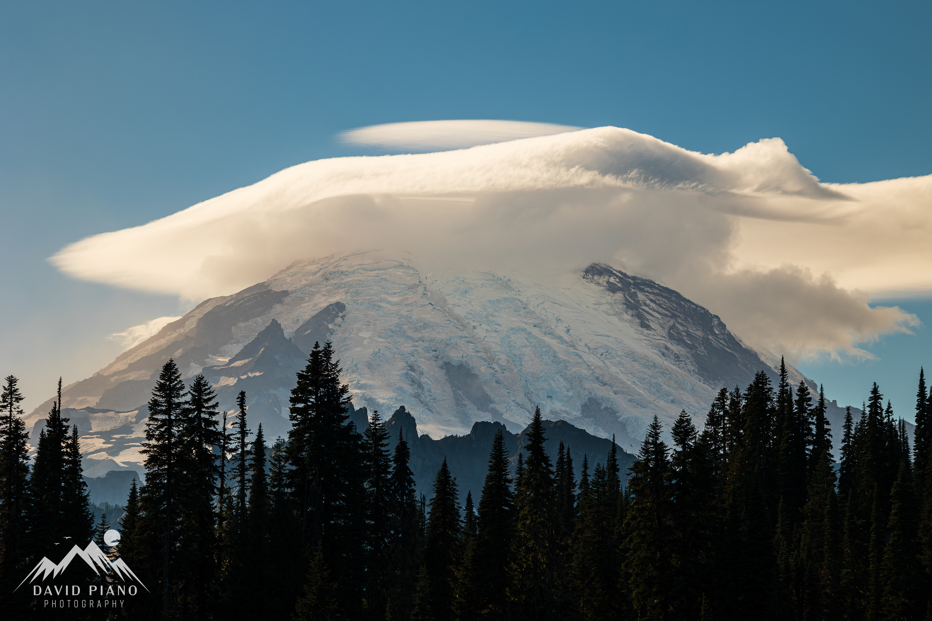Stunning lenticular cap cloud crowning the peak of Mount Rainier