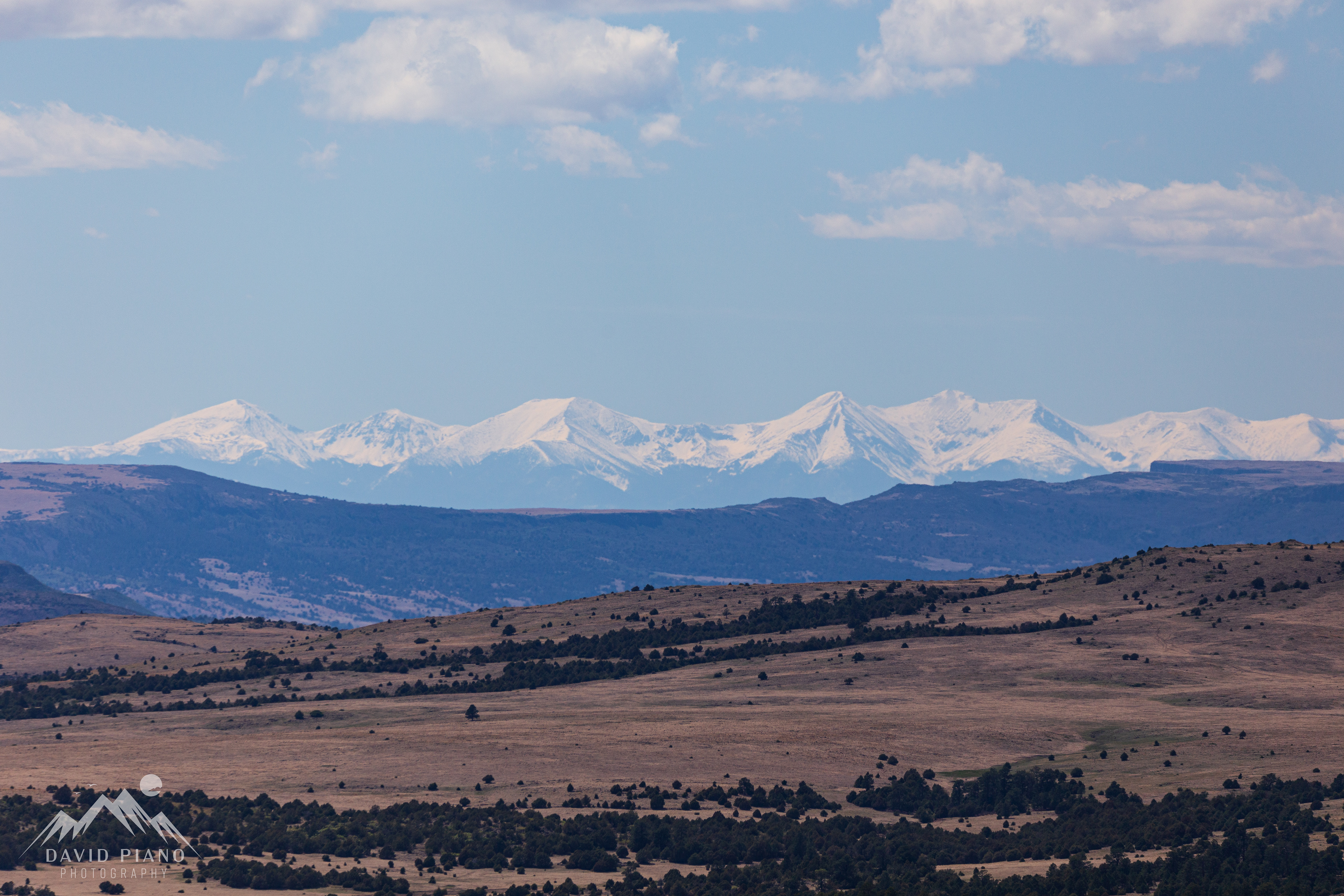 Snow-capped Rockies seen from the rim trail at Capulin Volcano